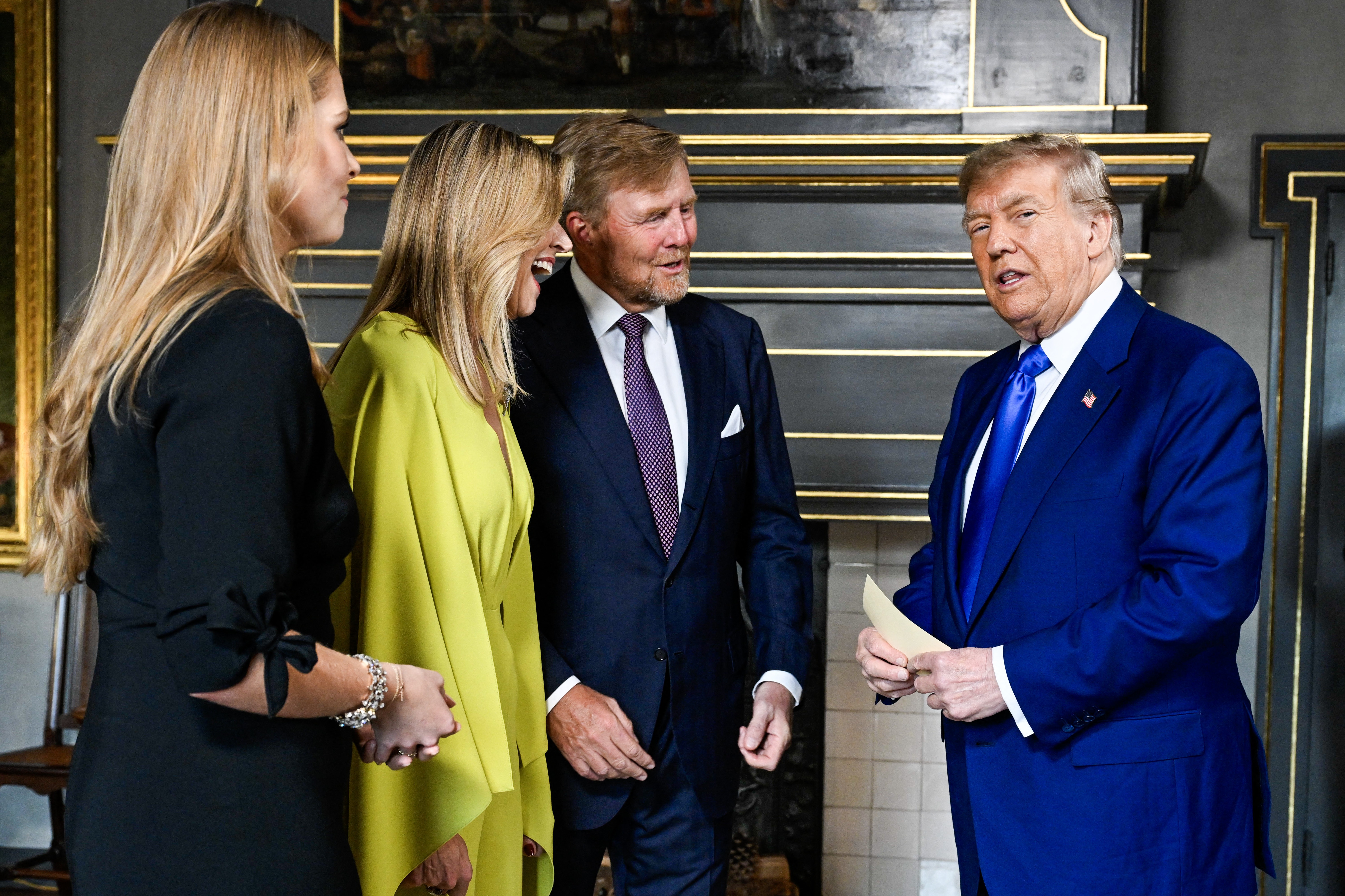 Inside the Huis ten Bosch Royal Palace, Trump is warmly greeted by King Willem-Alexander, Queen Máxima, and Crown Princess Amalia of Netherlands. The atmosphere is light as they share a laugh ahead of the social dinner.