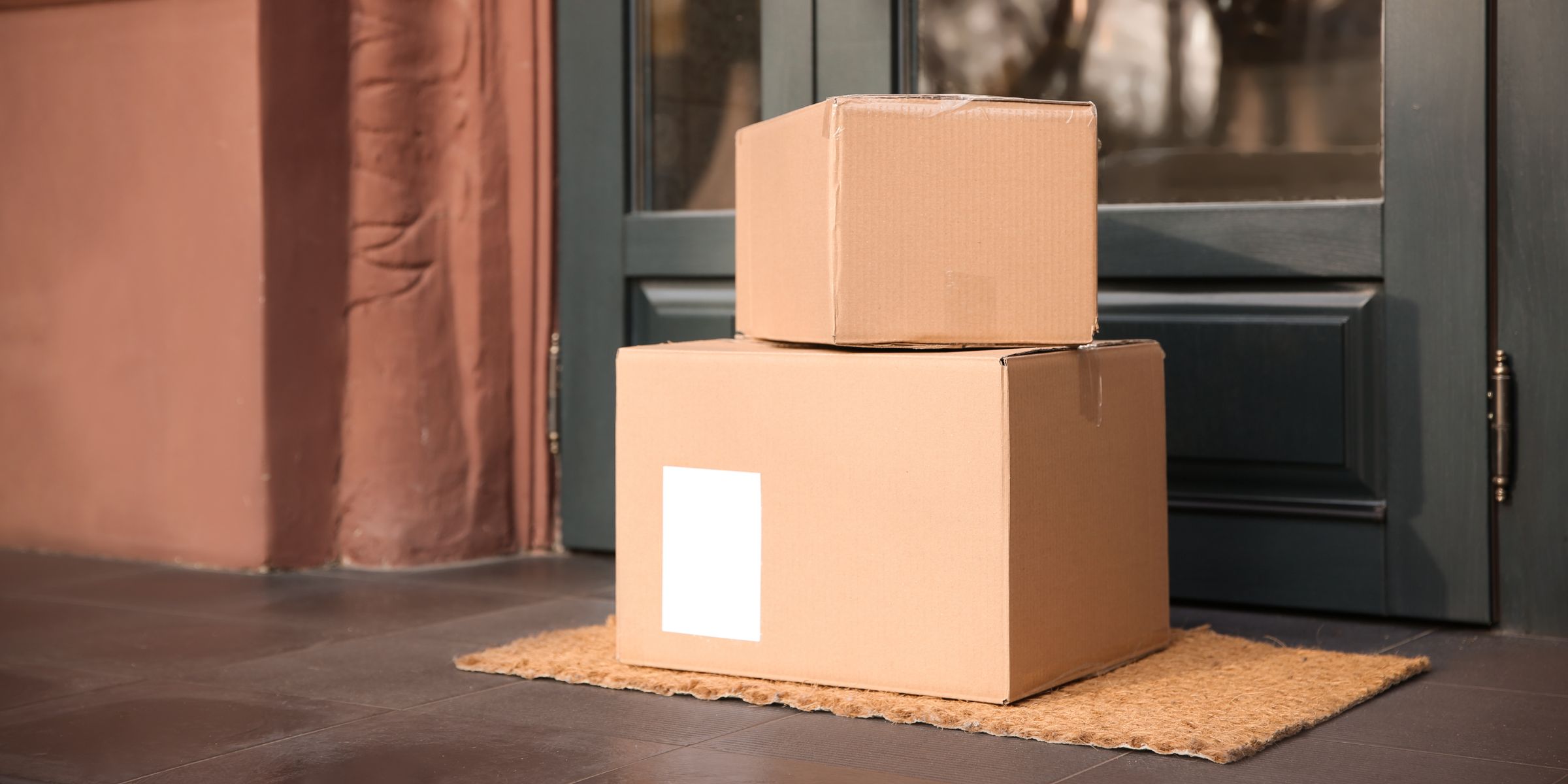 Two boxes on a doorstep | Source: Shutterstock