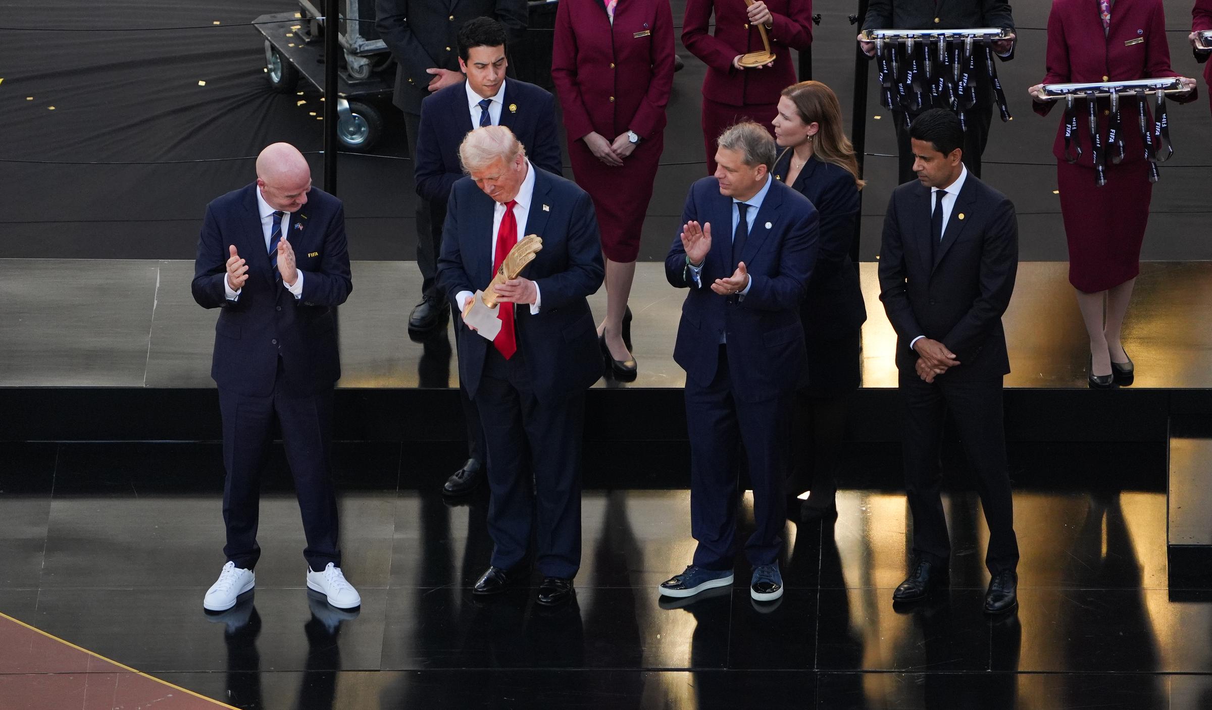 Donald Trump presenting a trophy following the FIFA Club World Cup final match on July 13, 2025, in New Jersey. | Source: Getty Images