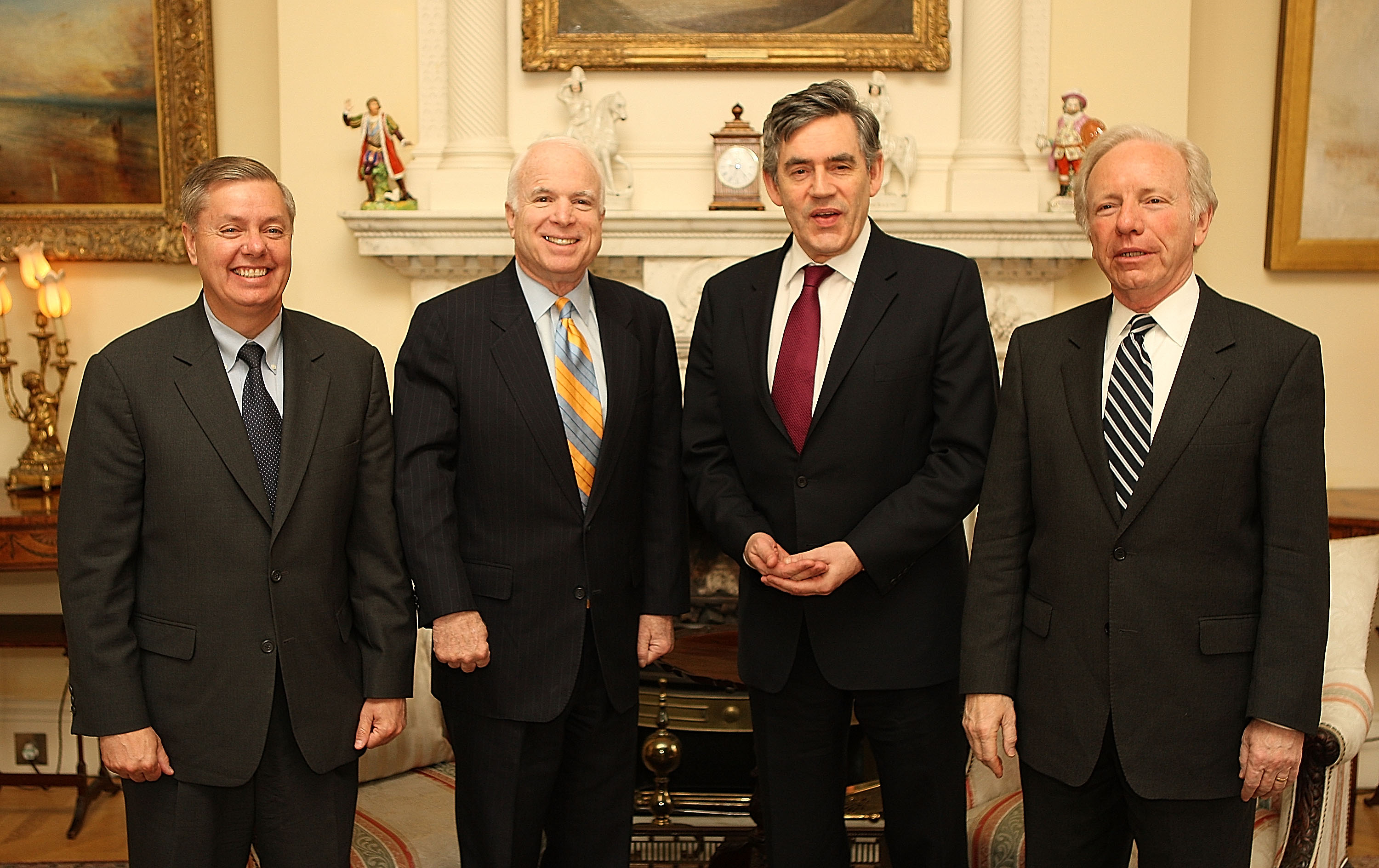 Standing alongside Sen. John McCain, Sen. Joe Lieberman, and British Prime Minister Gordon Brown, Lindsey Graham takes part in high-level discussions abroad. For more than two decades, Graham and John McCain worked closely together on national security and foreign policy, advocating for American global leadership. | Source: Getty Images