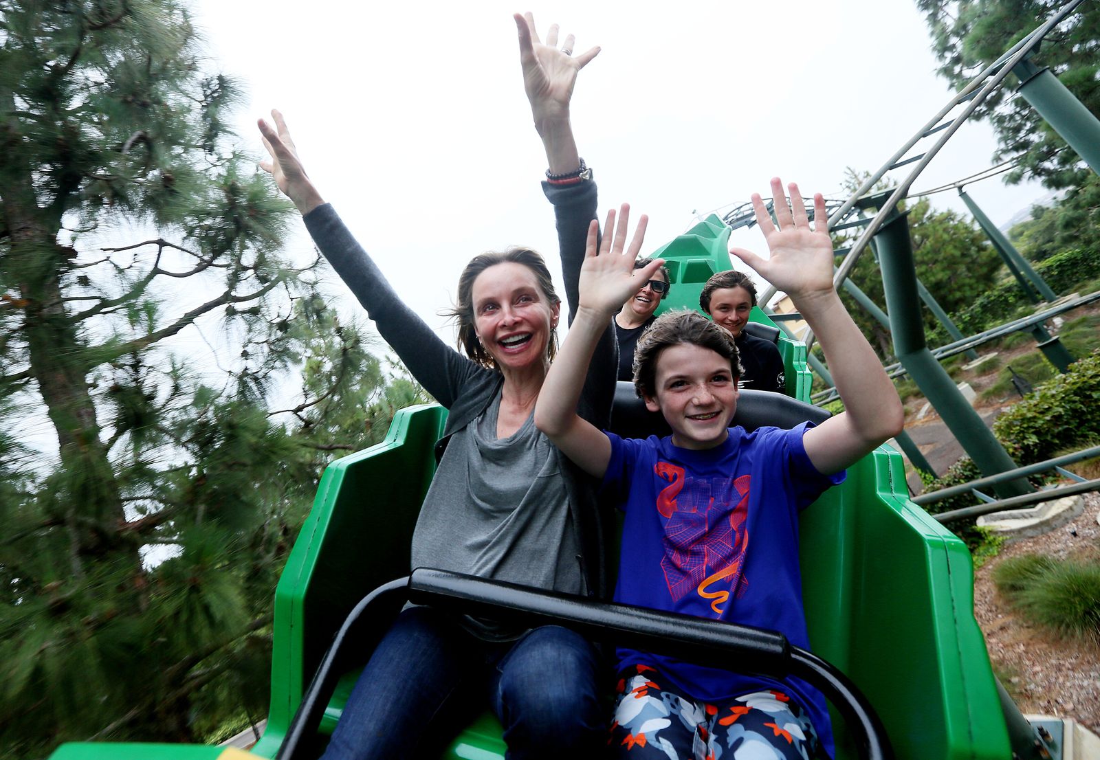 Calista and Liam Flockhart ride a rollercoaster at Legoland California on August 24, 2012, in Carlsbad, California. | Source: Sandy Huffaker/Corbis/Getty Images