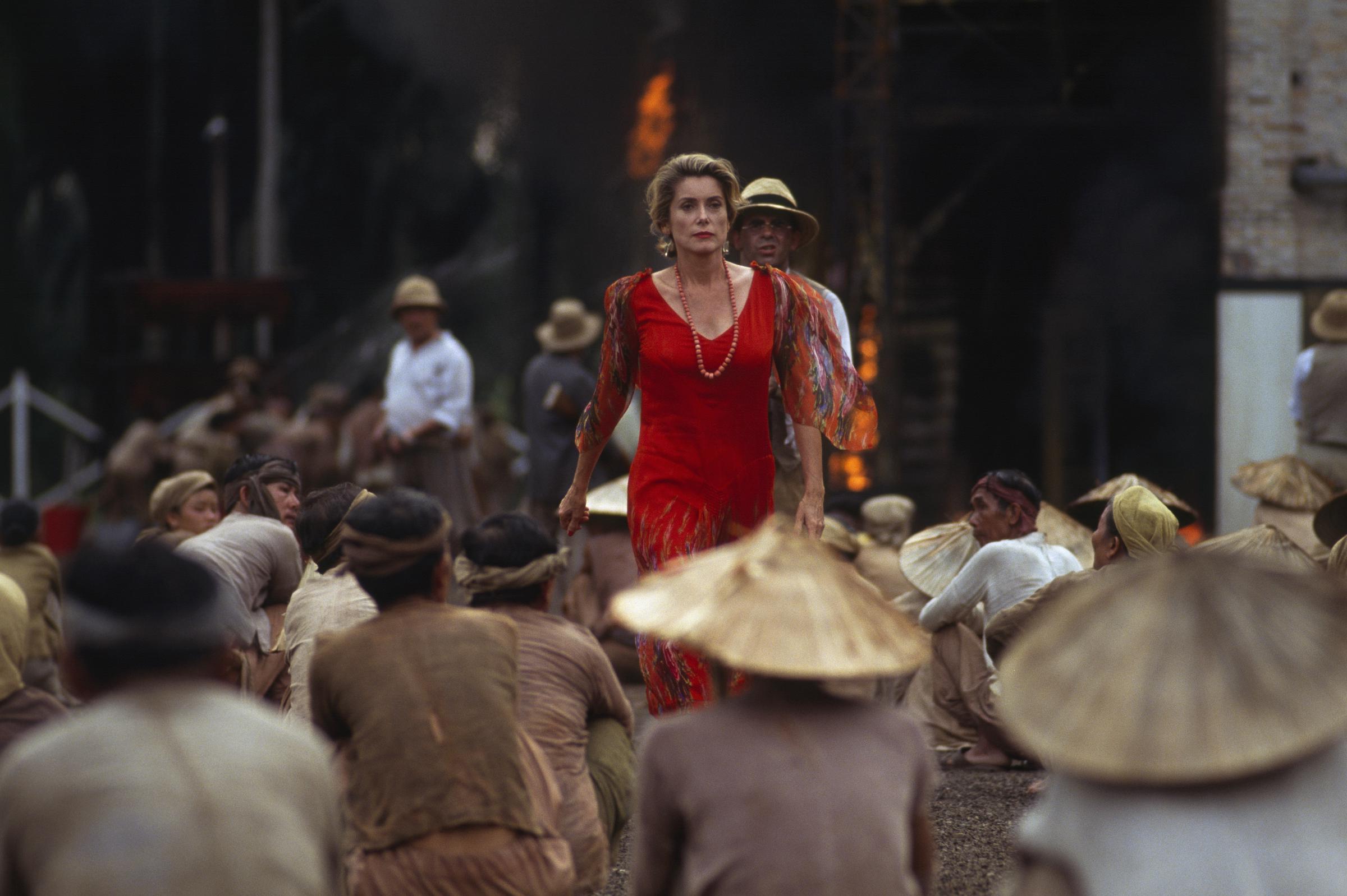 Catherine Deneuve on the set of "Indochine," circa 1990. | Source: Getty Images