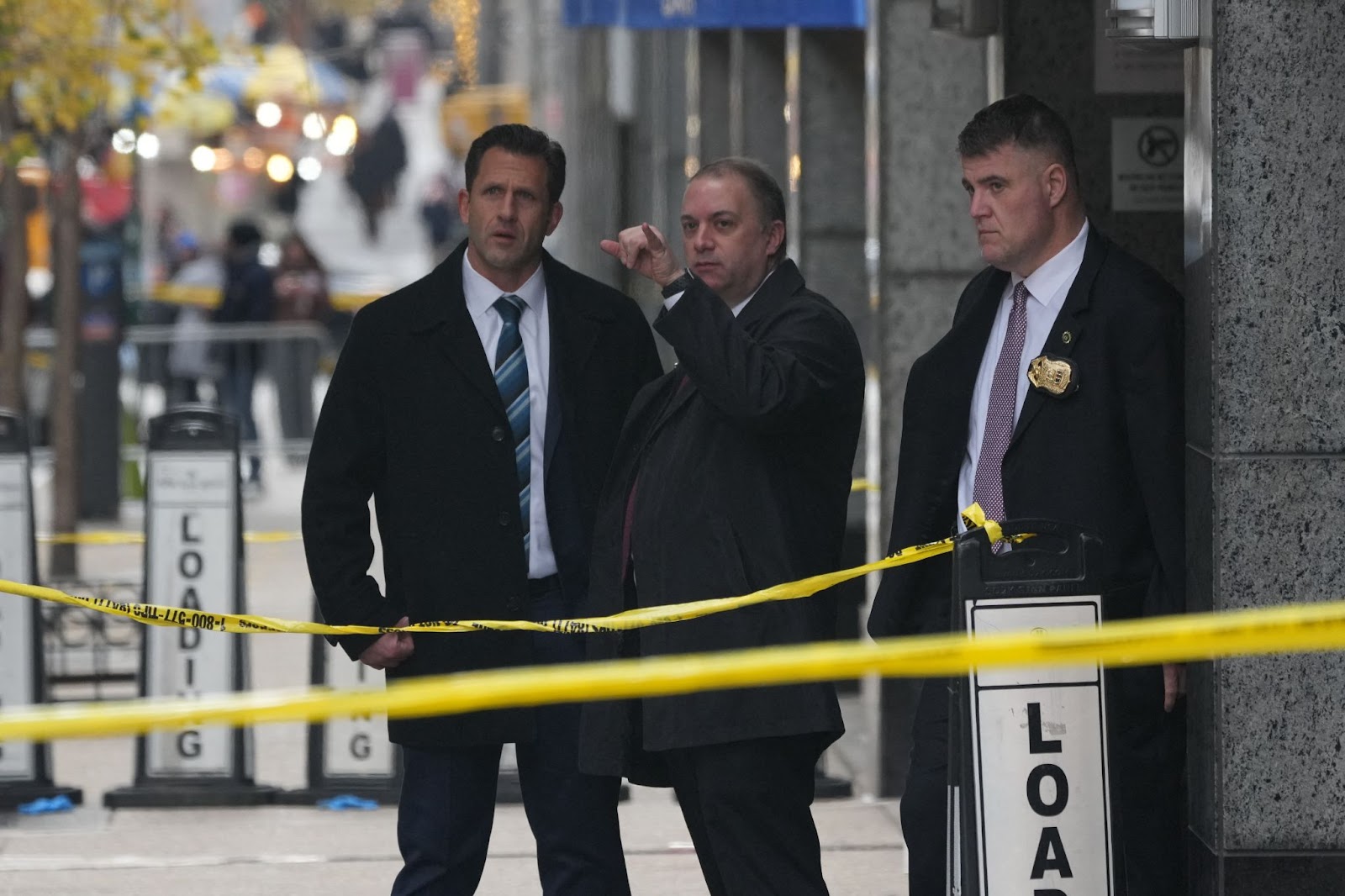 Police officers at the scene of Brian Thompson's fatal shooting at the New York Hilton Midtown hotel on December 4, 2024. | Source: Getty Images