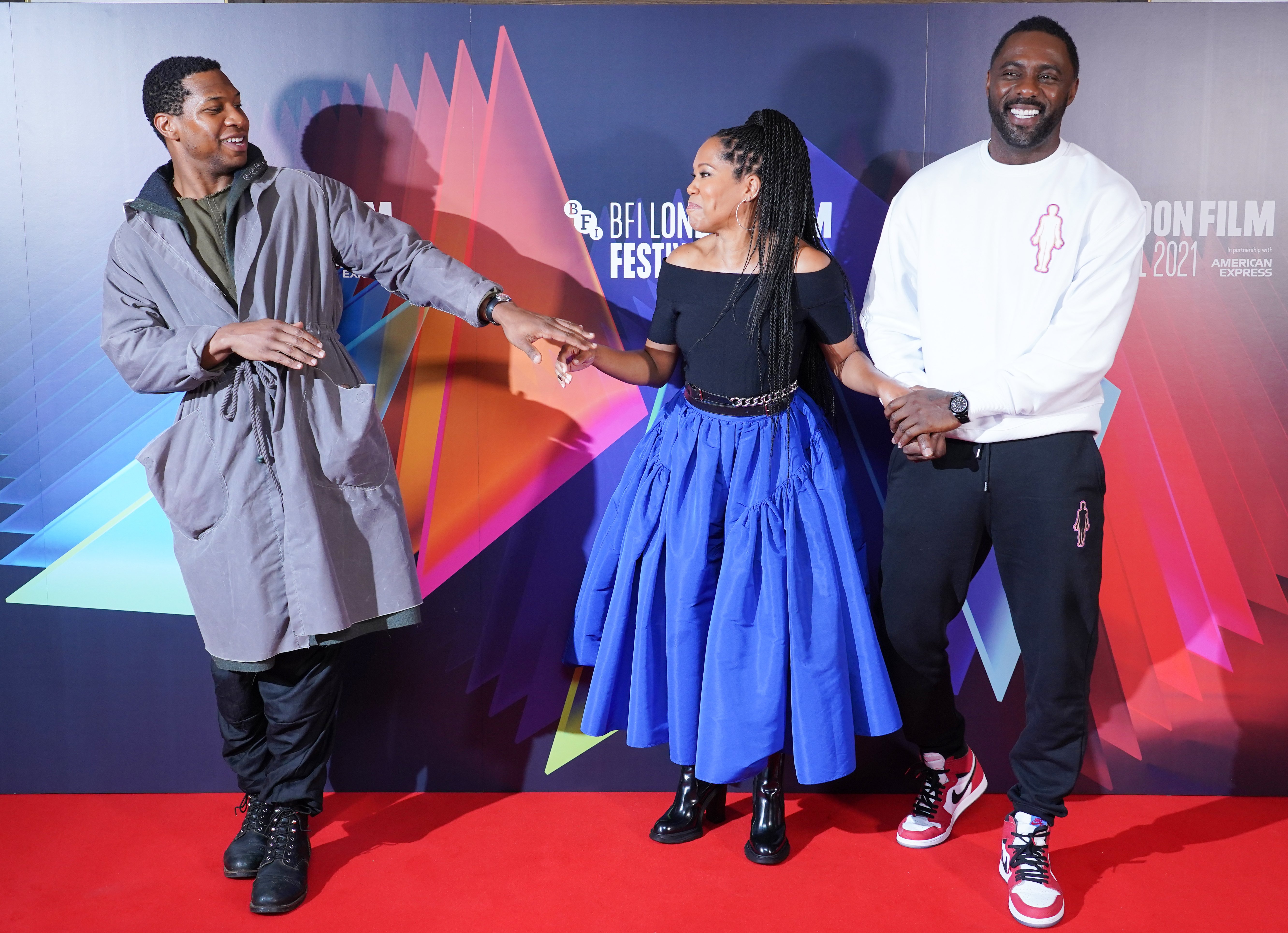 Jonathan Majors, Regina King and Idris Elba at "The Harder They Fall" press conference at the Mayfair Hotel in London, during the BFI London Film Festival, on Wednesday, October 6, 2021. | Source: Getty Images