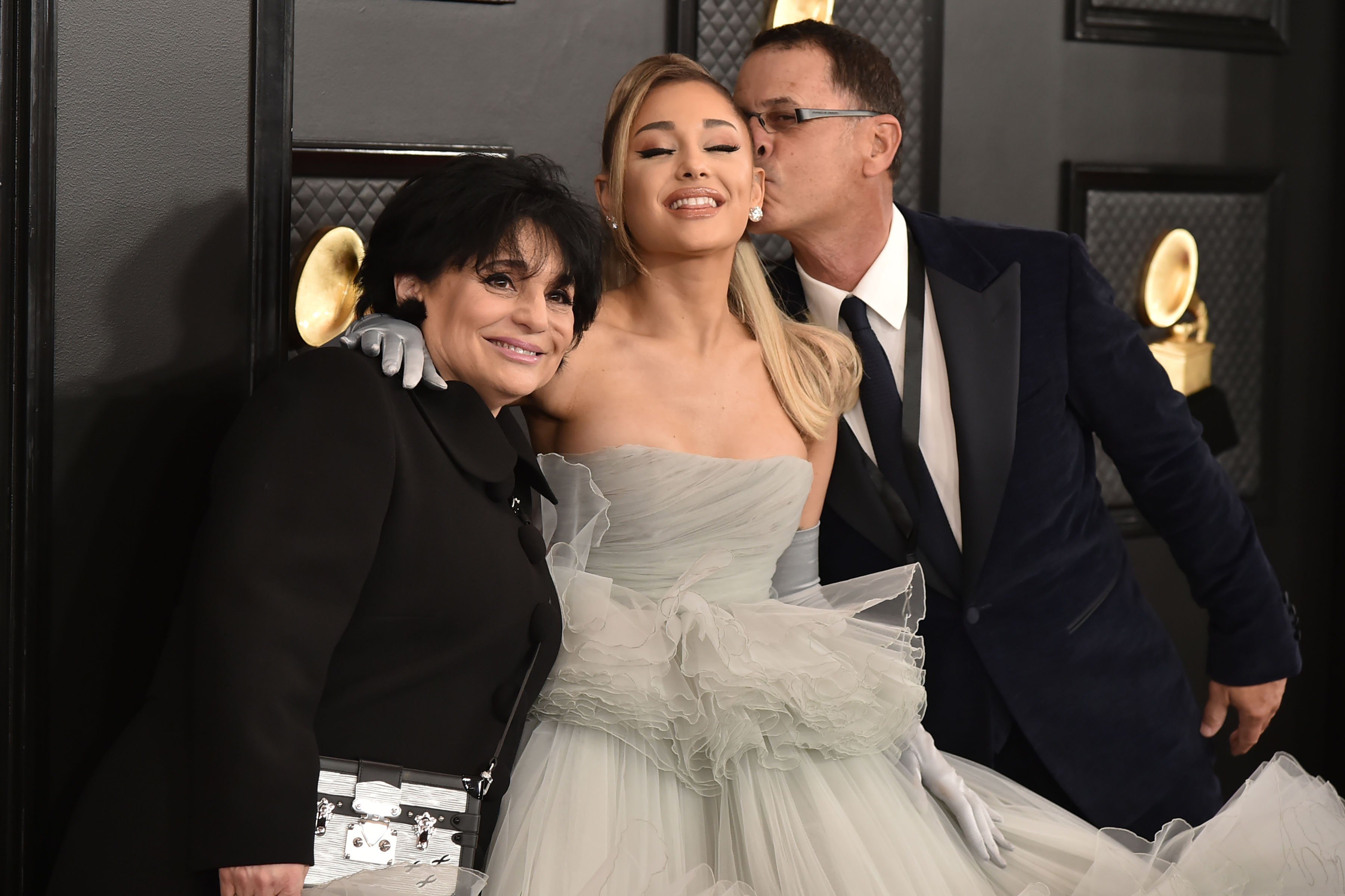  Ariana Grande with her parents Joan Grande and Edward Butera at the 62nd Annual Grammy Awards in 2020, in Los Angeles. | Source: Getty Images