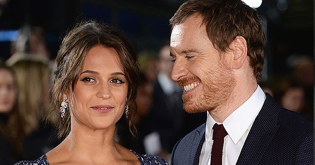 A portrait of Alicia Vikander and her husband Michael Fassbender smiling | Photo: Getty Images