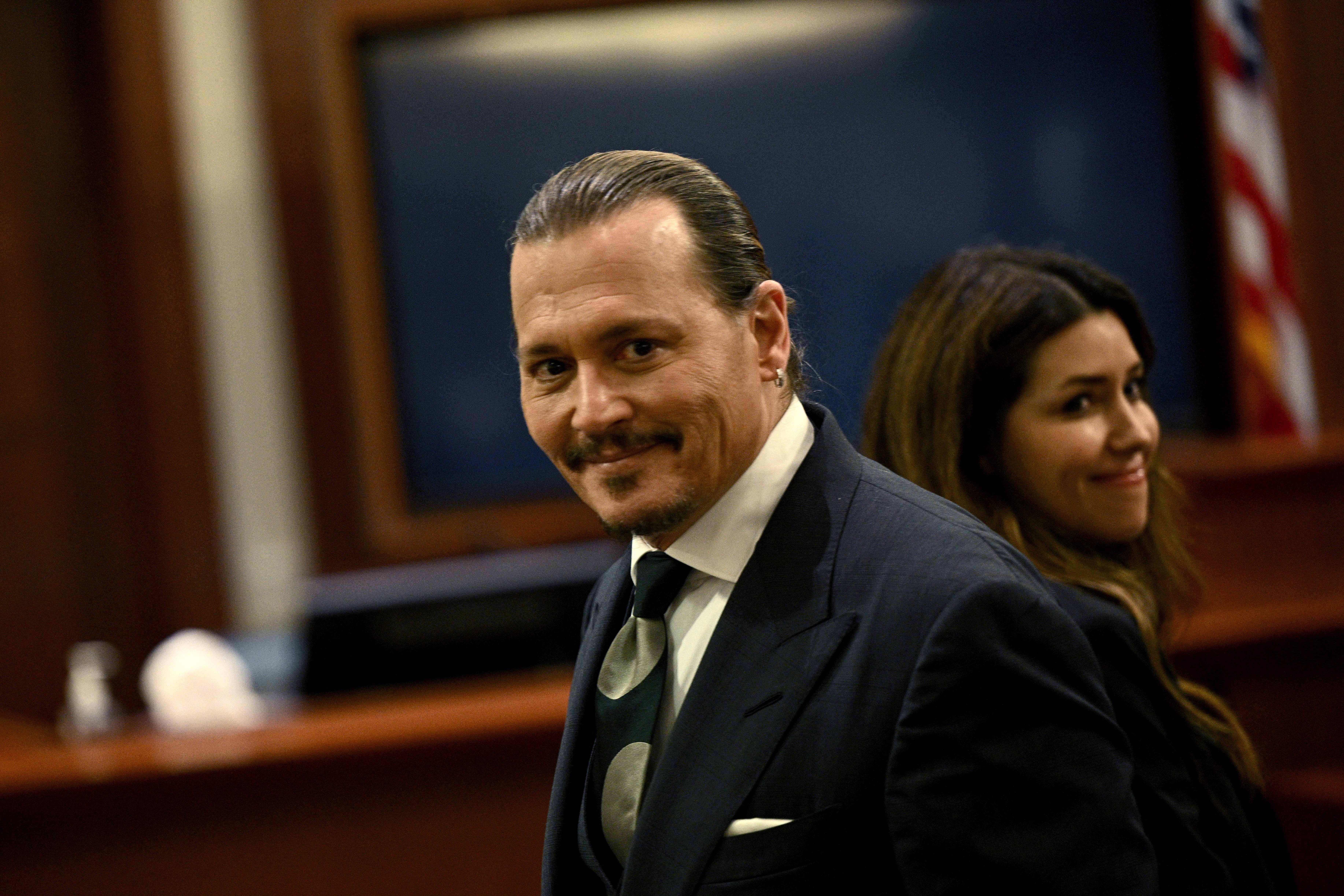 Johnny Depp and Atty. Camille Vasquez in the courtroom at the Fairfax County Circuit Courthouse in Fairfax, Virginia, on April 26, 2022. | Source: Getty Images