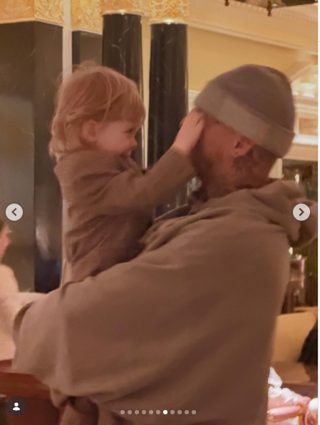 Miles Langford holds Osbourne's son aloft inside The Dorchester, the toddler gleefully pushing the man's grey beanie down over his eyes with both hands. It is one of the more candid shots in the carousel, and easily one of the most telling. | Source: Instagram/kellyosbourne