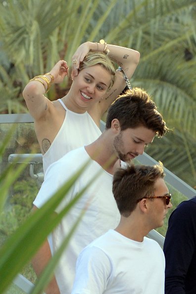 Cody Simpson, Patrick Schwarzenegger and Miley Cyrus are sighted at La Cote in the Fontainebleau Miami Beach Florida | Photo: Getty Images