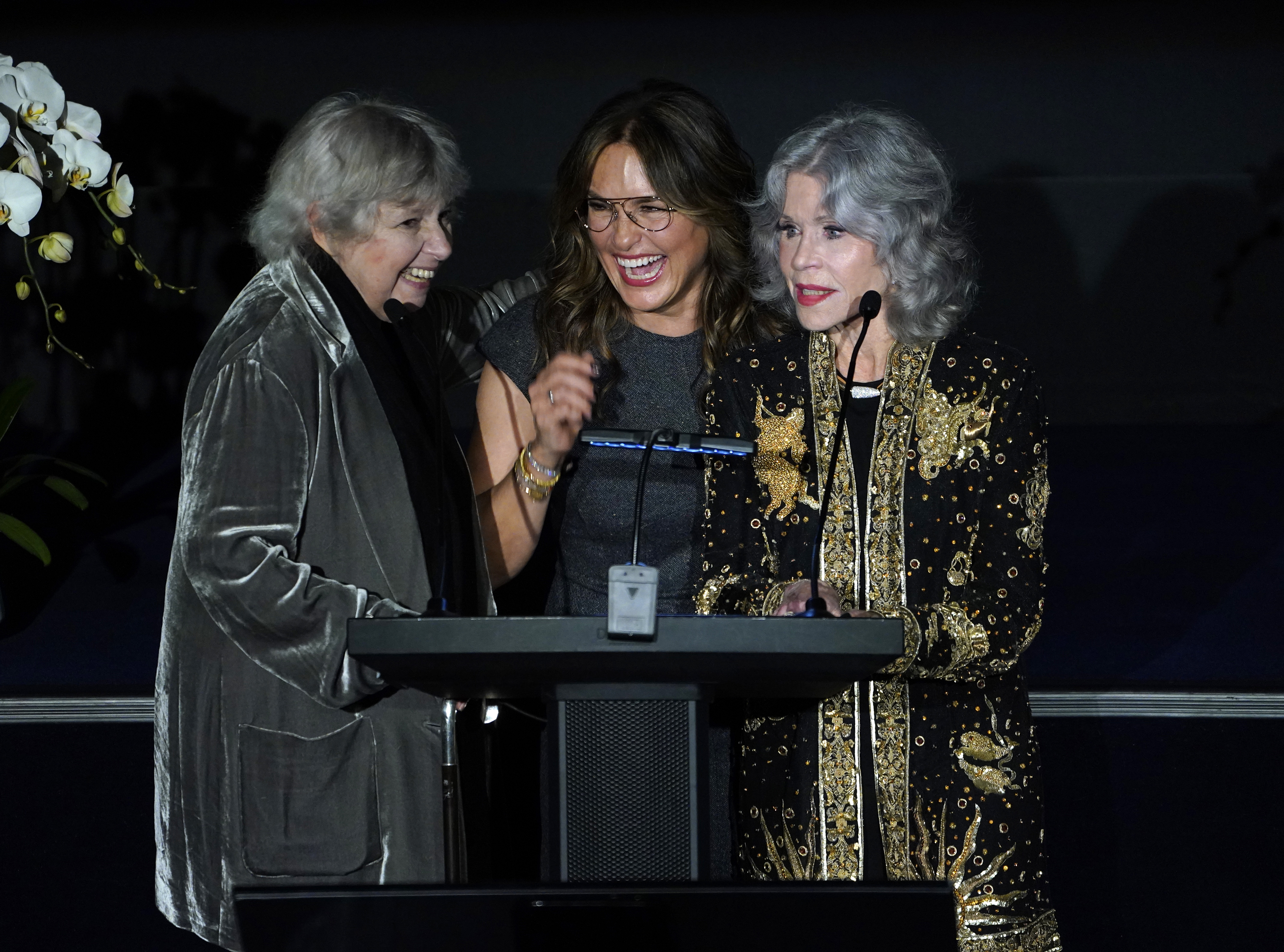 Robin Morgan, Mariska Hargitay, and Jane Fonda speaking at The WMC Women's Media Awards in New York City on October 19, 2023 | Source: Getty Images
