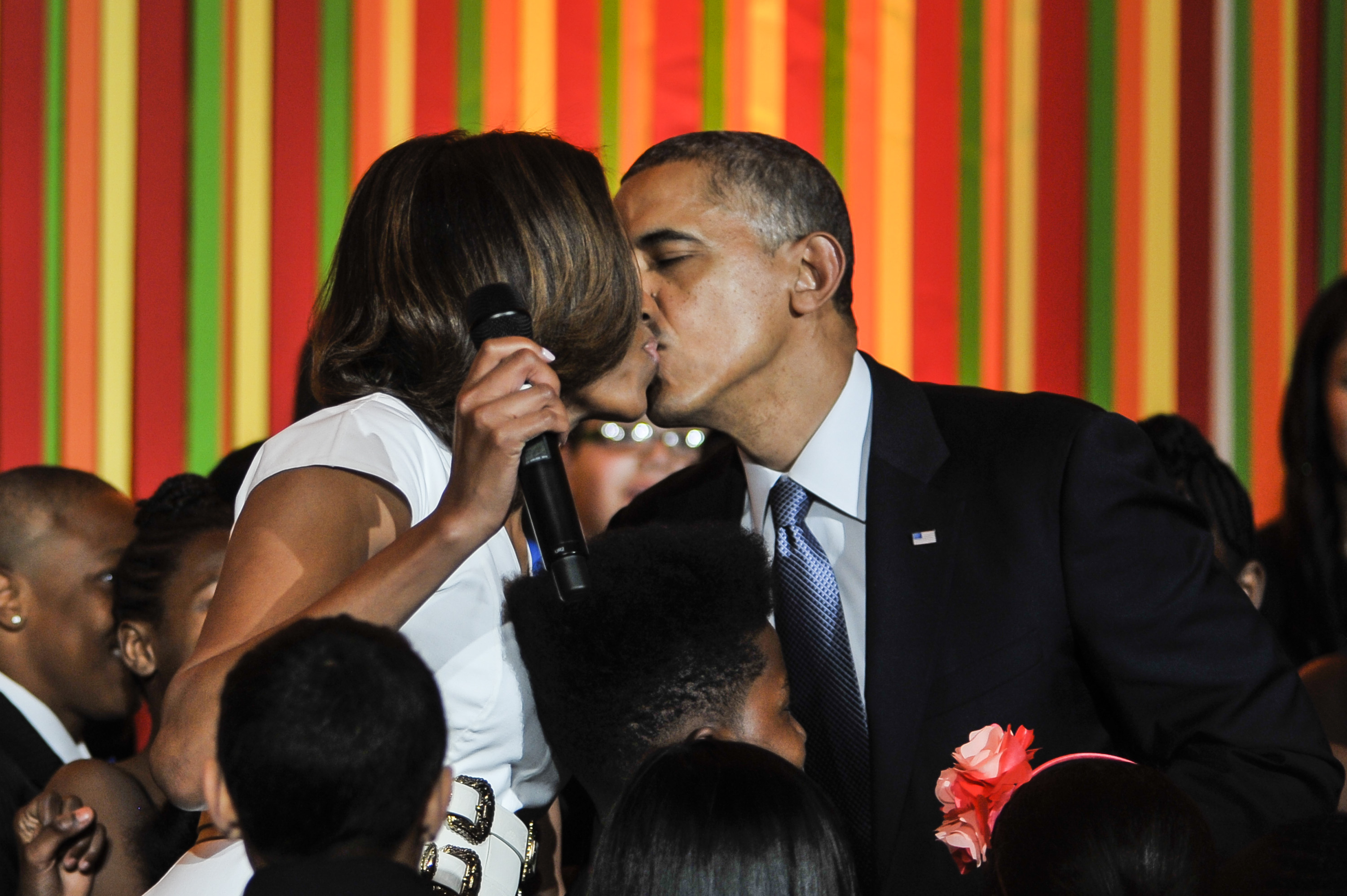 Michelle and Barack Obama sharing a kiss during the White House Talent Show on May 20, 2014, in Washington, D.C. | Source: Getty Images