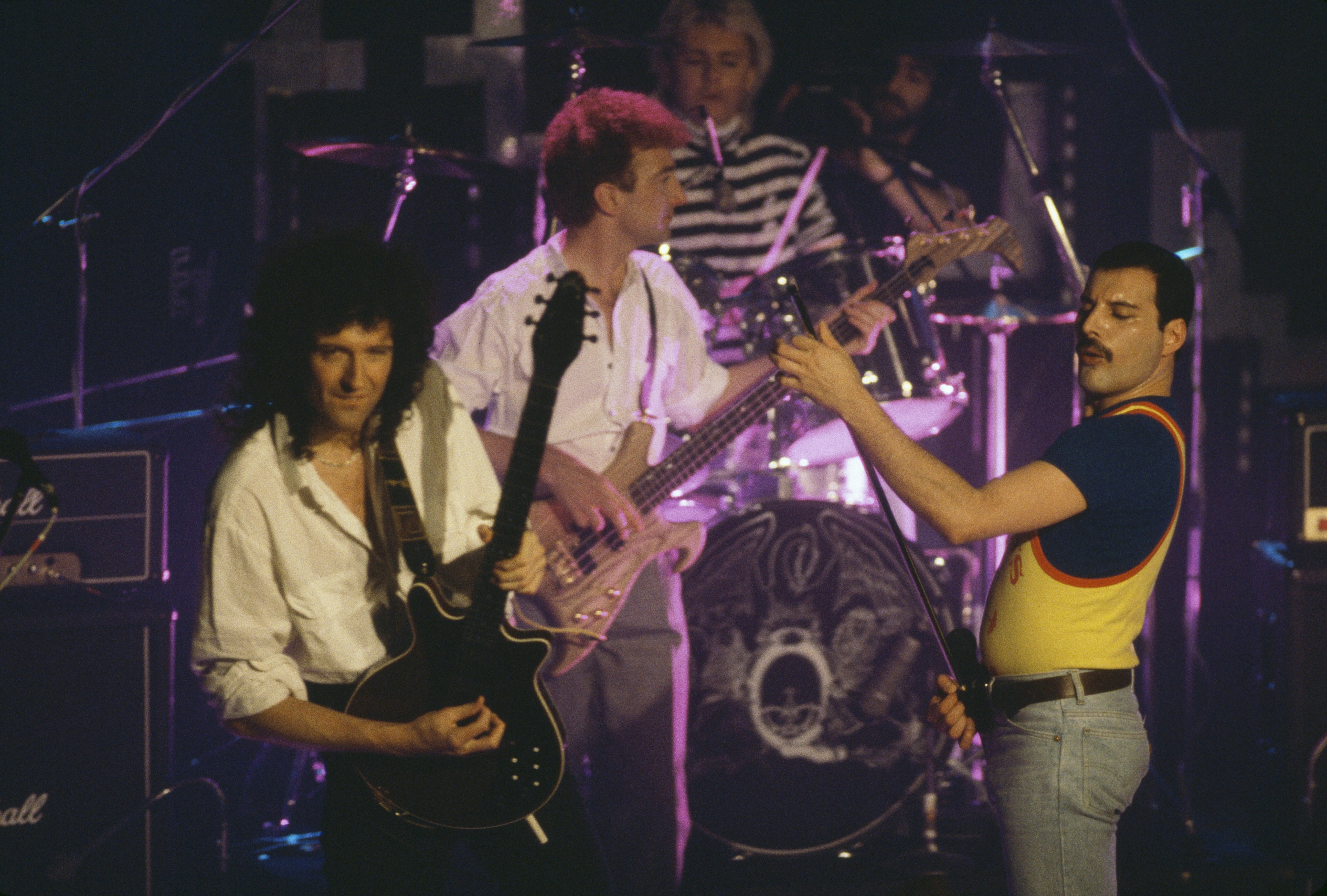 Queen performing on stage, 1986. Left to right: Brian May, John Deacon, Roger Taylor and Freddie Mercury. | Photo: GettyImages