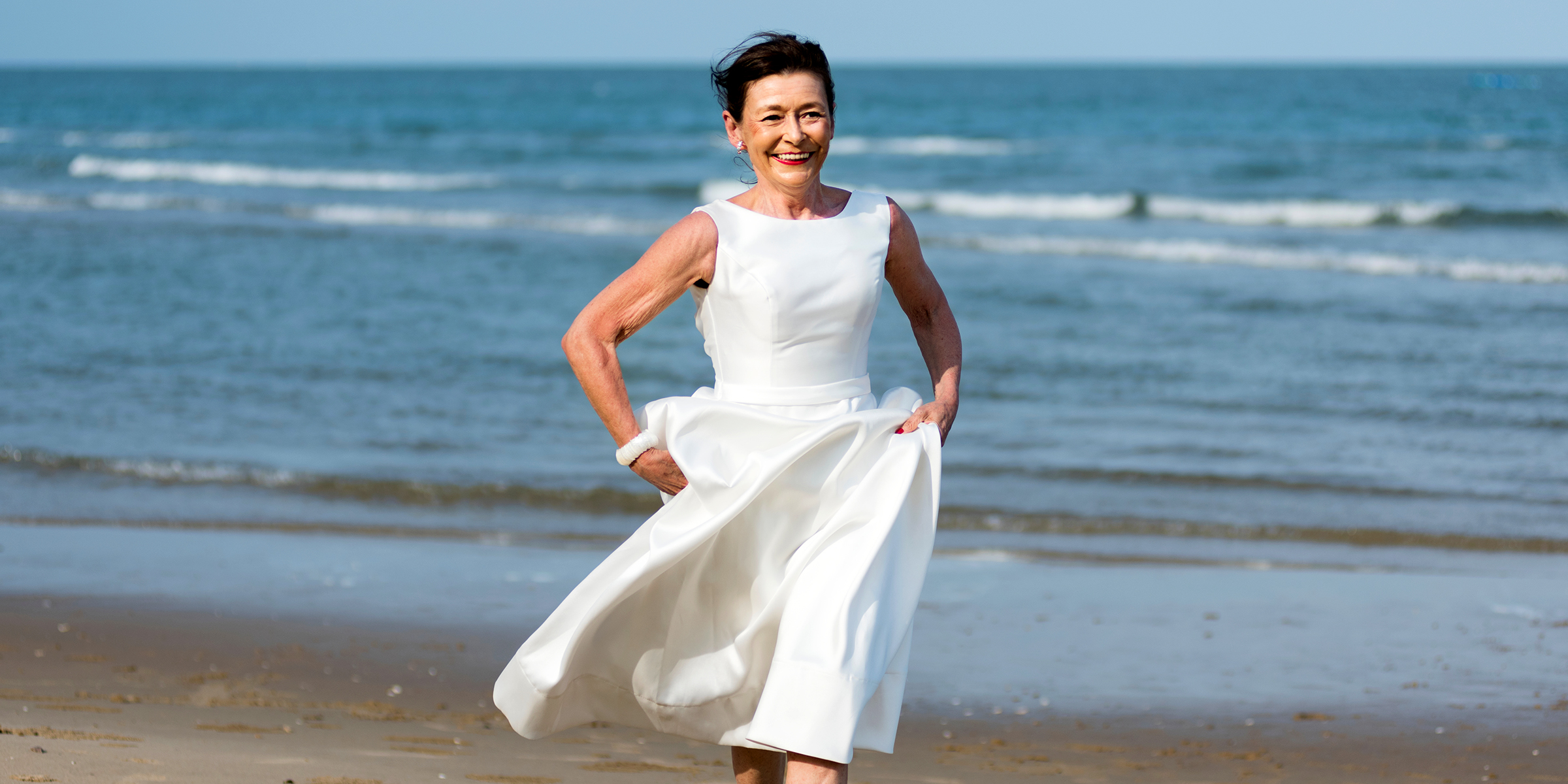 Woman runs in a white dress | Source: Shutterstock