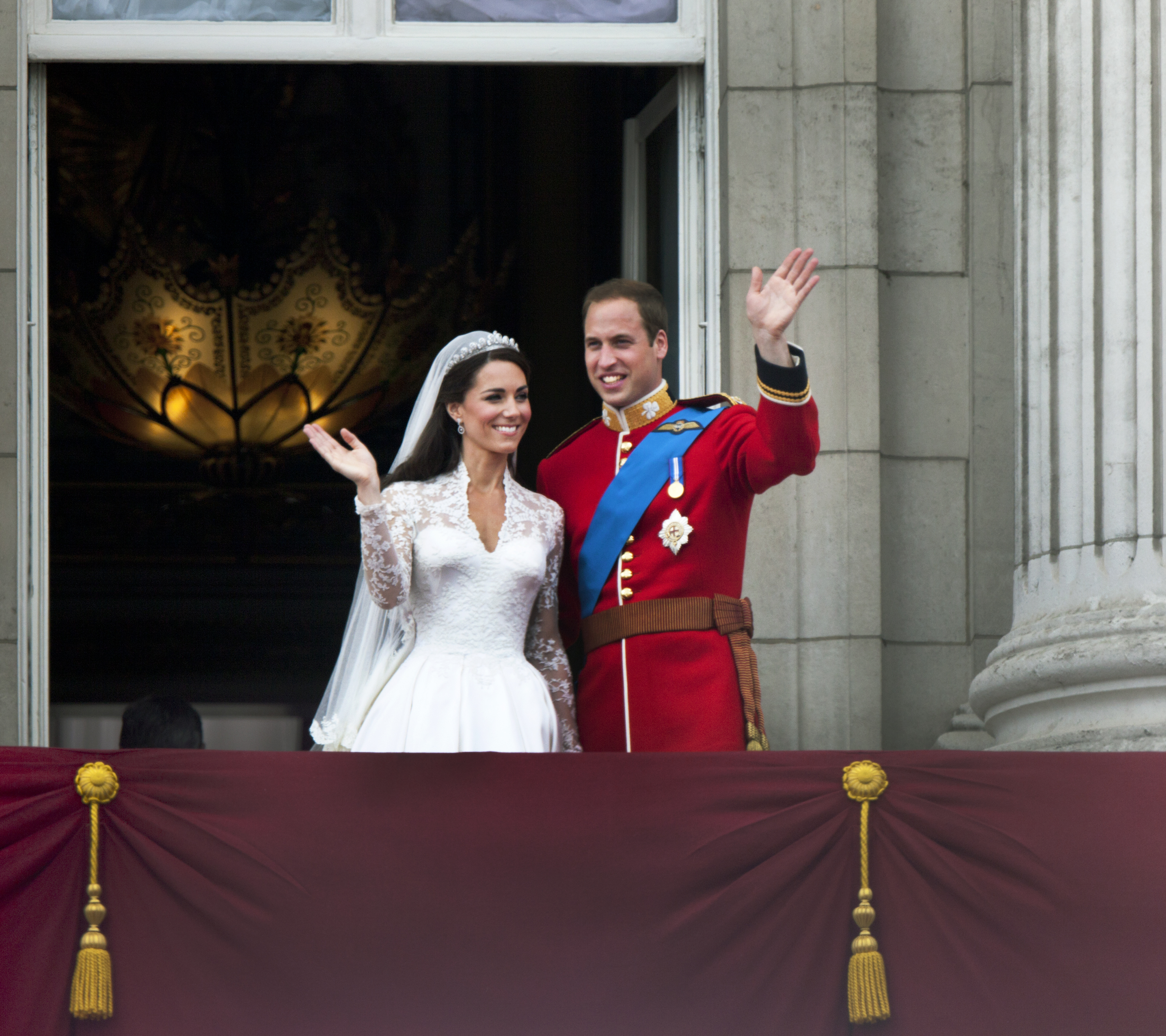 Catherine, Duchess of Cambridge, and Prince William greet well-wishers from the balcony at Buckingham Palace after their wedding, in London, on April 29, 2011 | Source: Getty Images