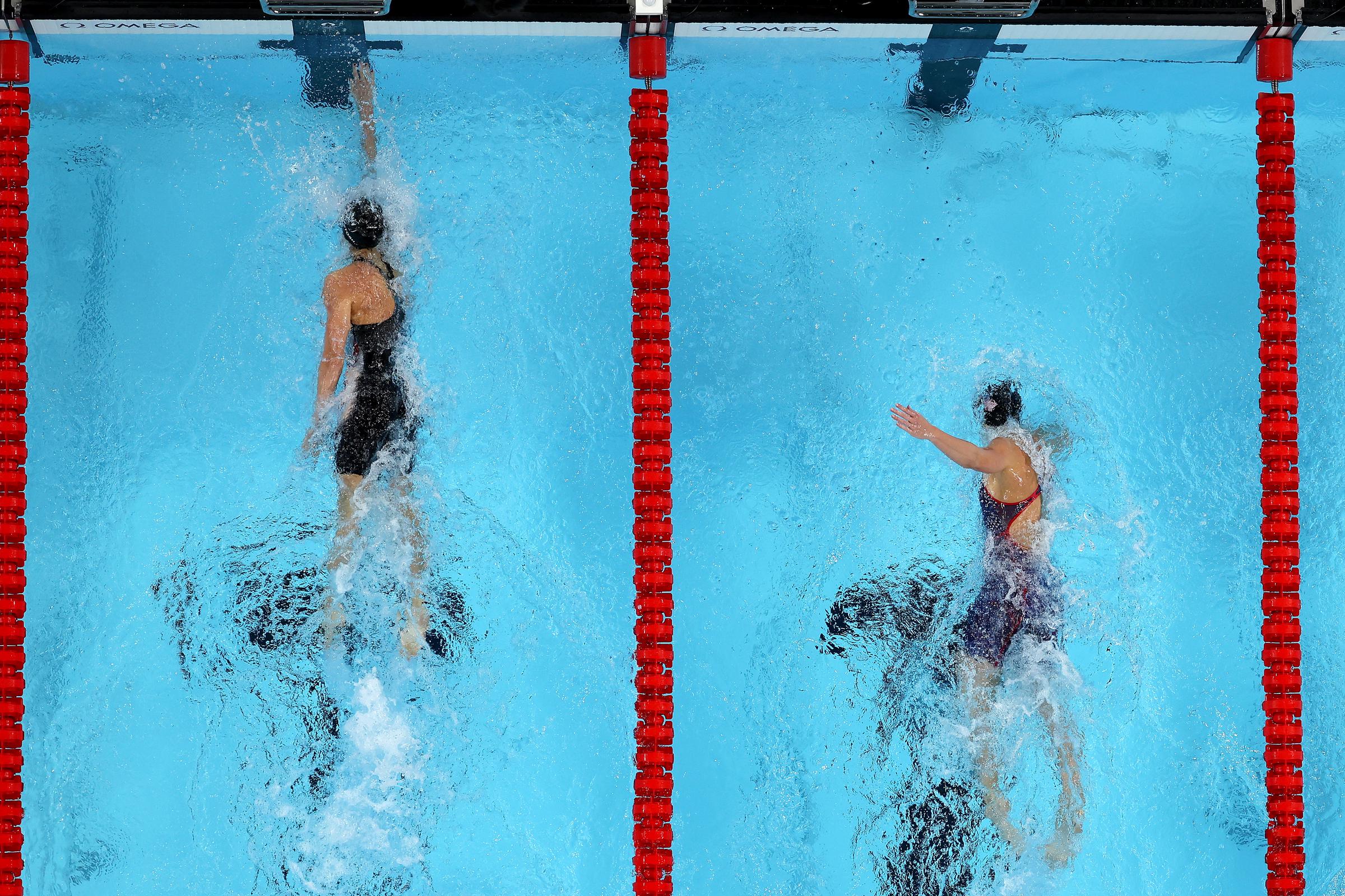 Summer McIntosh touches the finish to win gold as she competes against Alex Walsh in the Women's 200m Individual Medley Final at the Olympic Games Paris 2024 in Nanterre, France, on August 3, 2024. | Source: Getty Images