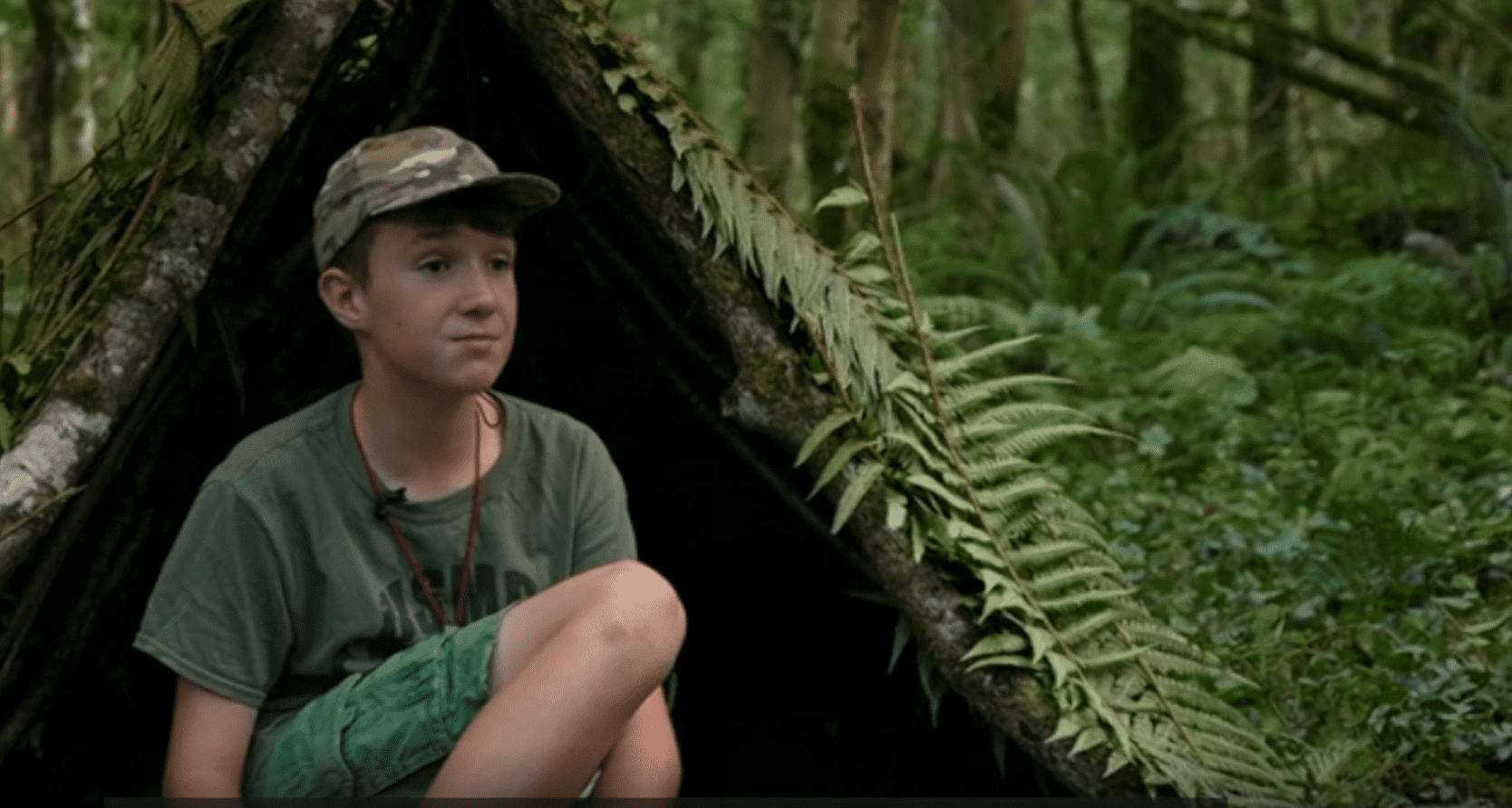 11-year-old Max Woosey in a shelter he built.│Source: BBC News