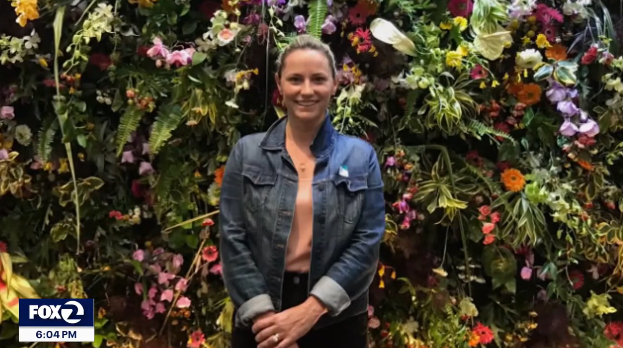 Kate Vitt poses in front of a floral display in an undated image | Source: YouTube/KTVUFox2