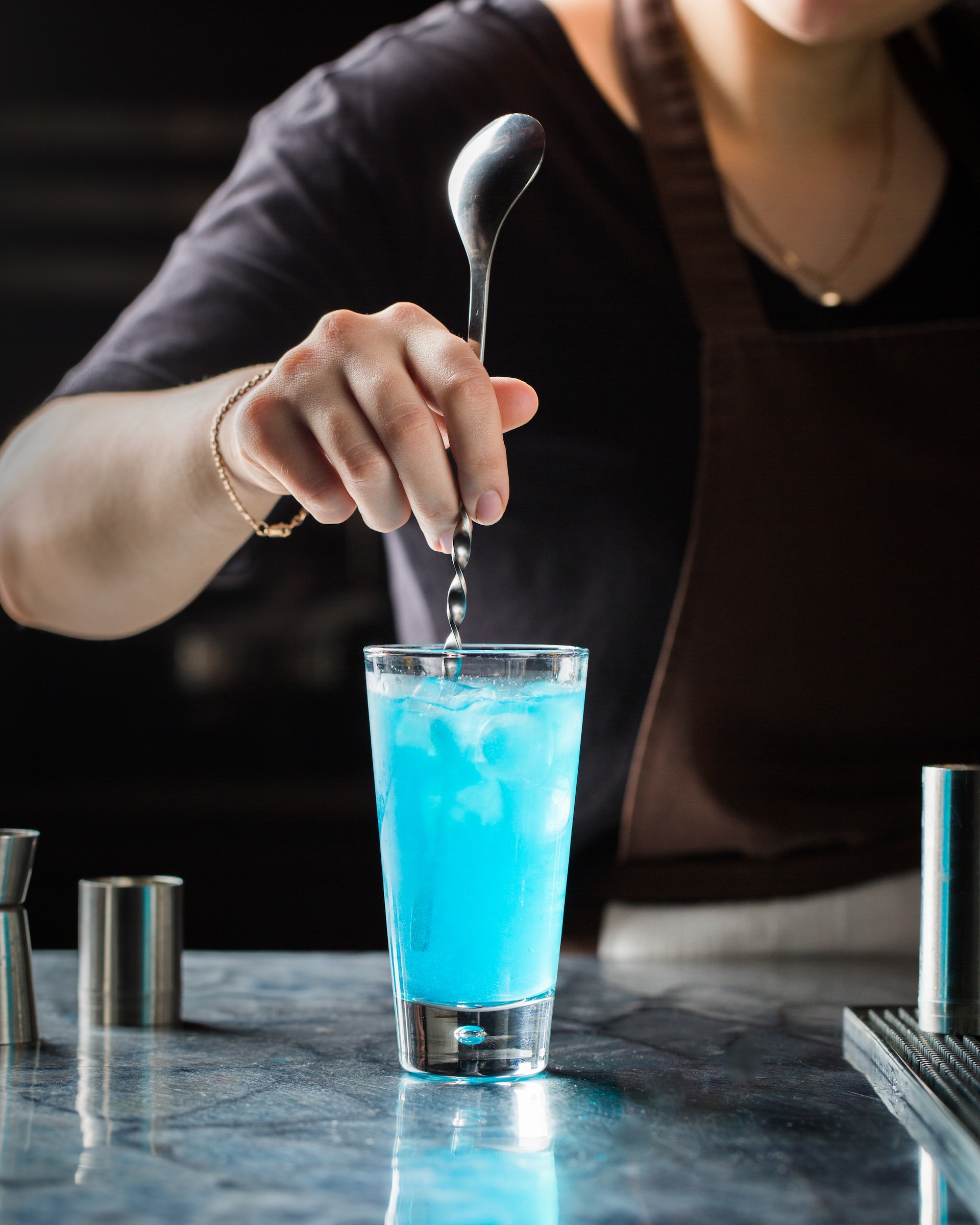A waiter mixing drinks | Source: Shutterstock