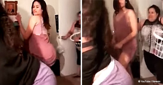 Furious mother smacks her girls after they do a sexy dance on camera