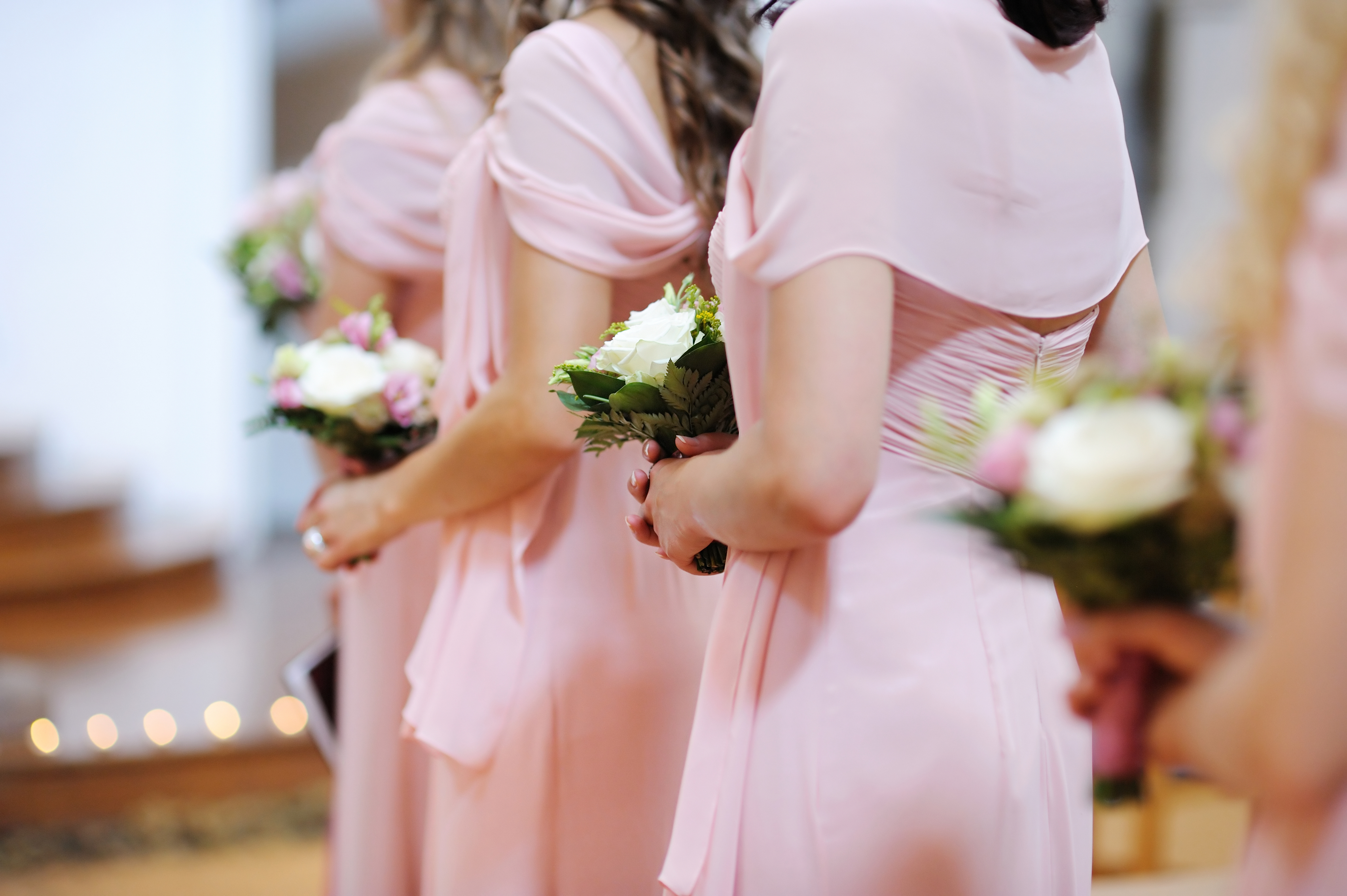 Three bridesmaids in pink dresses | Source: Shutterstock