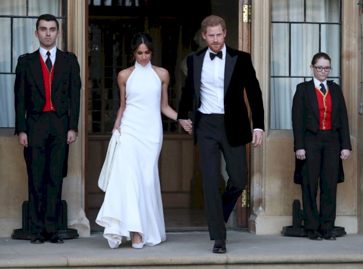Meghan Markle and Prince Harry on their way to their wedding reception Source |  Photo: Getty Images