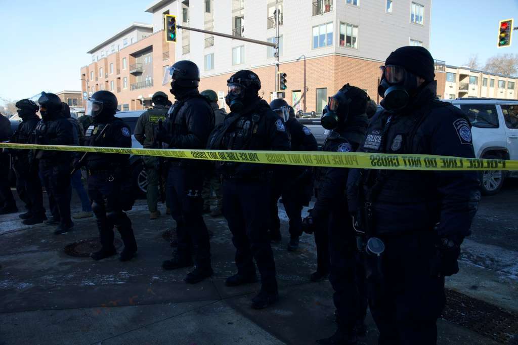 Law enforcement officers secure the scene at 26th Street West and Nicollet Avenue after a man was shot by a federal agent in Minneapolis on January 24, 2026 | Source : Getty Images