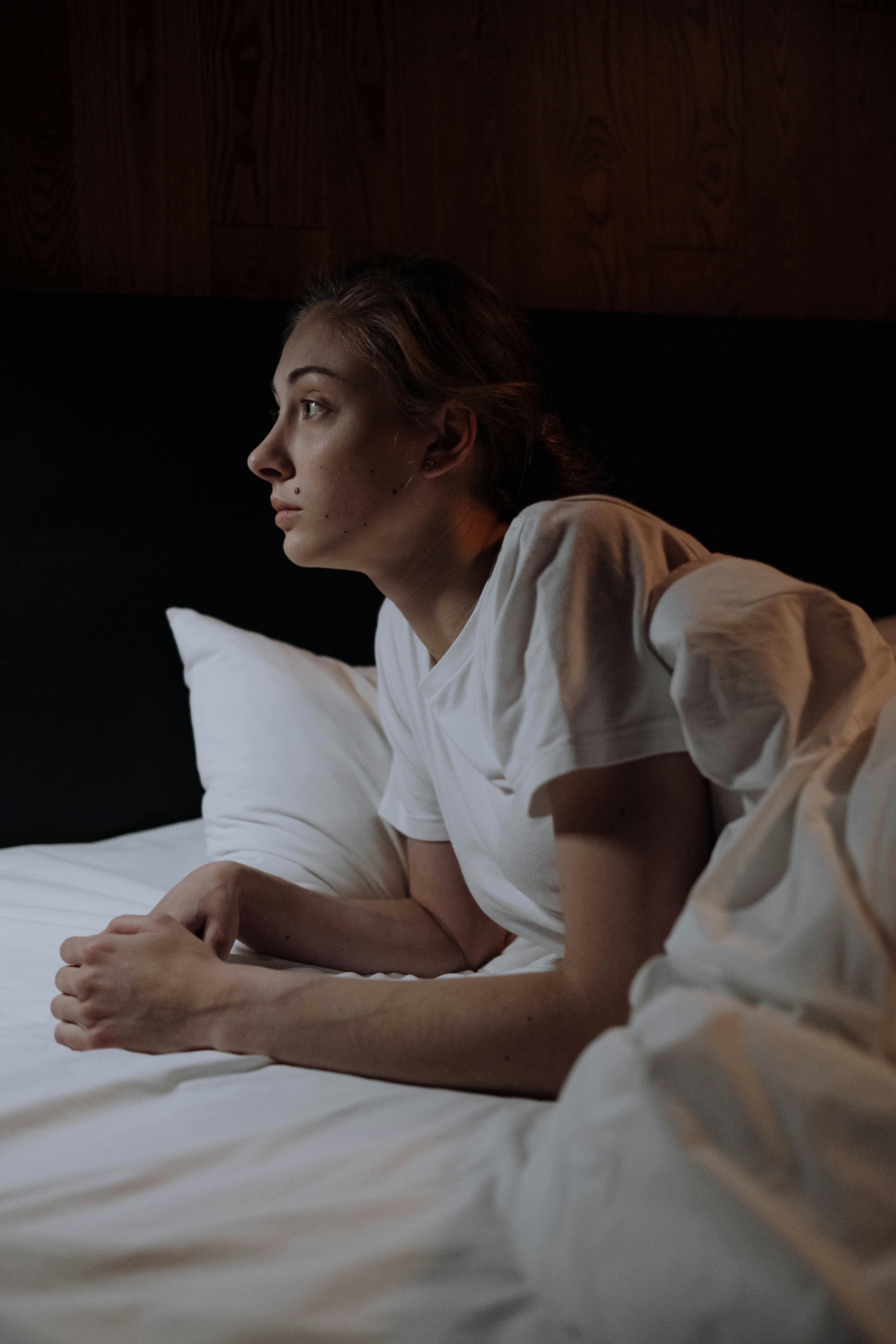 A woman awake in bed | Source: Pexels