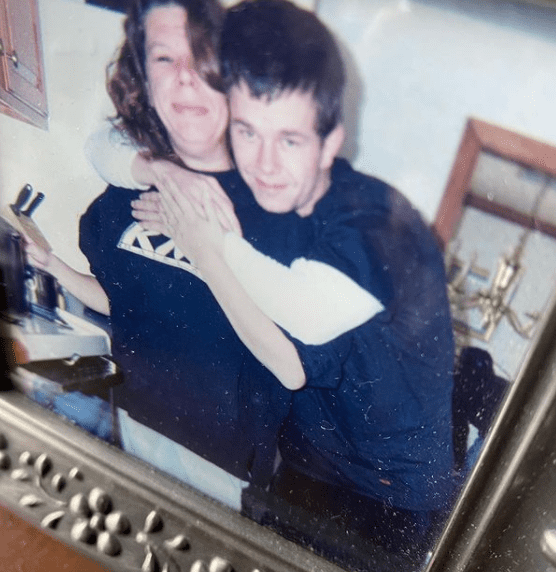 A photo of a young Mark Wahlberg hugging sister Debbie Wahlberg | Photo: Instagram.com/markwahlberg