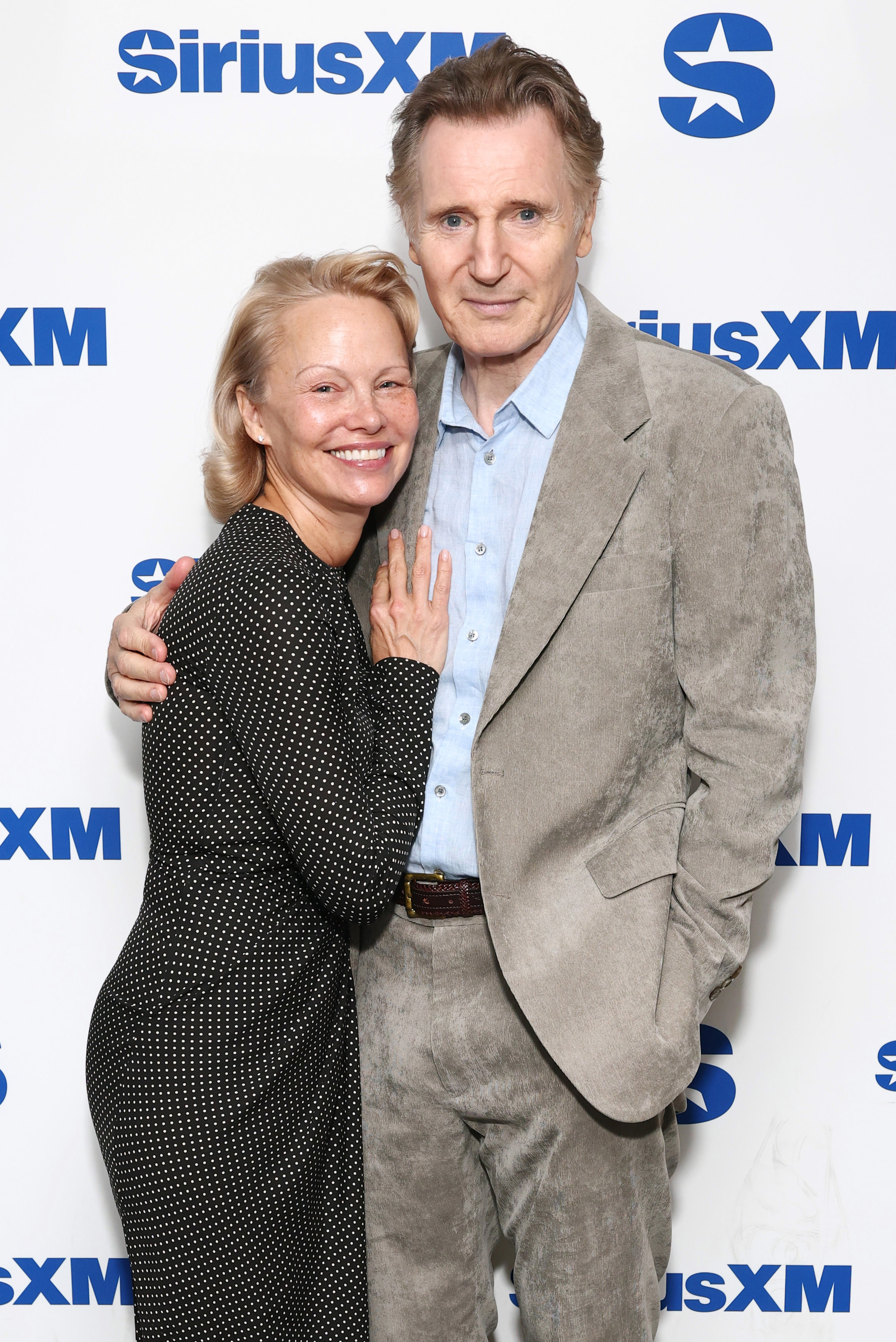 Pamela Anderson and Liam Neeson attend SiriusXM's Town Hall with the cast of "The Naked Gun" on July 30, 2025 in New York City. | Source: Getty Images