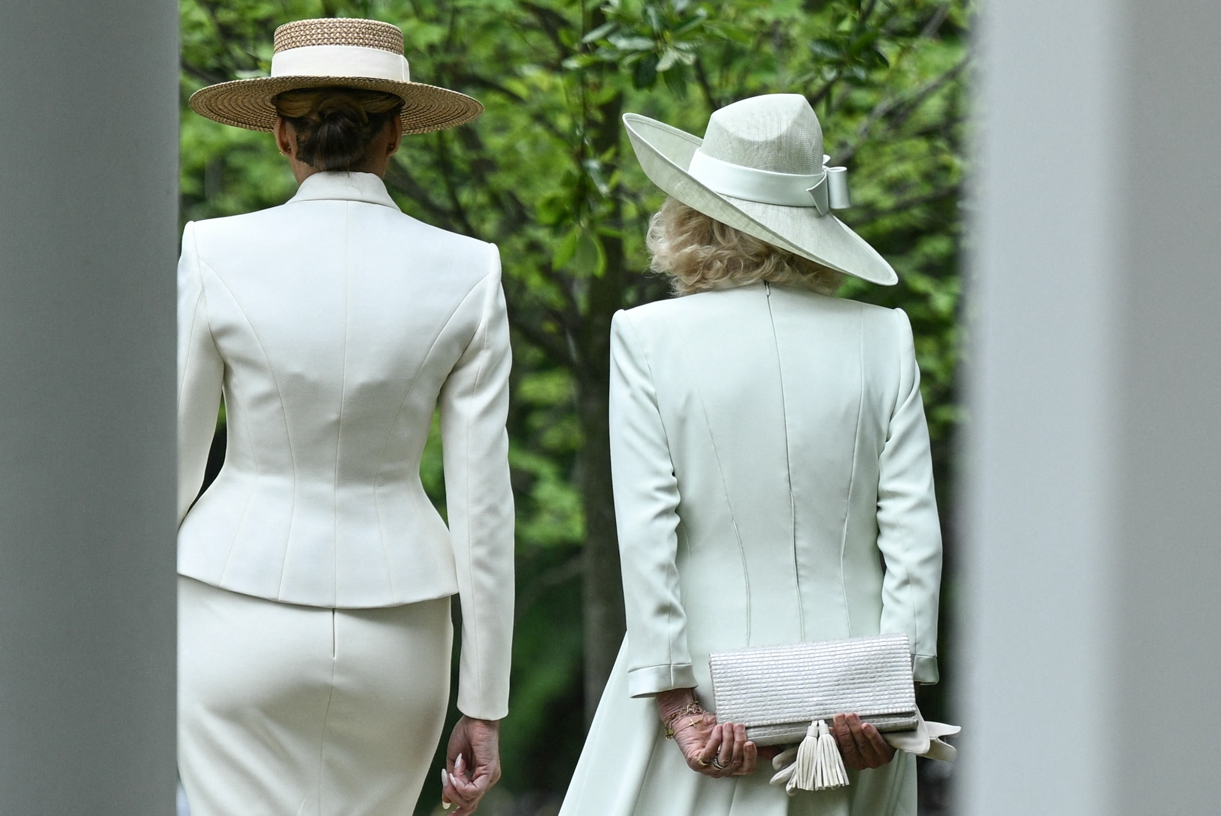 Melania Trump (L) and Queen Camilla walk together following an arrival ceremony on the White House South Lawn, April 28, 2026. | Source: Getty Images