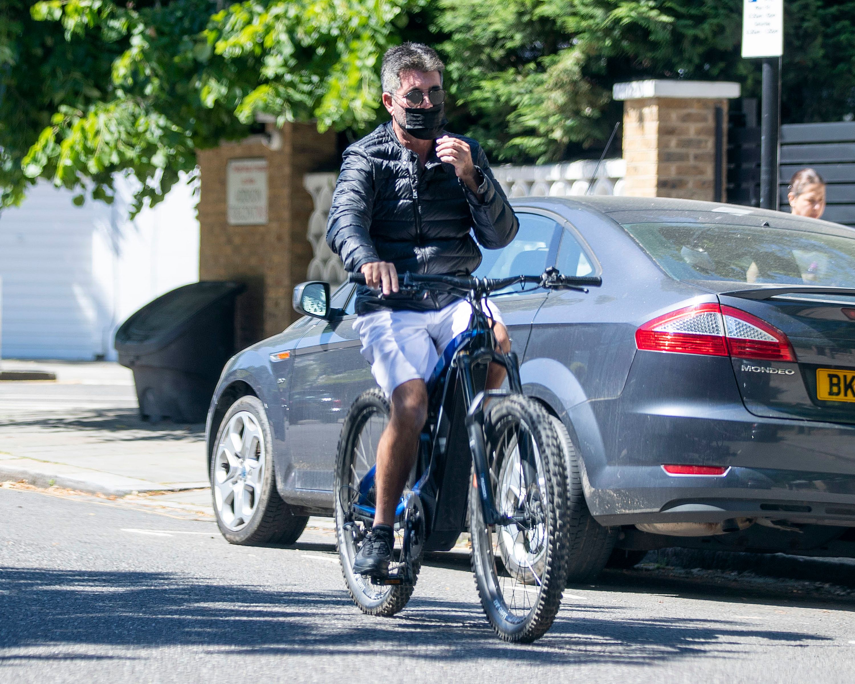Simon Cowell on his electric bicycle on June 15, 2021 in London, England | Source: Getty Images