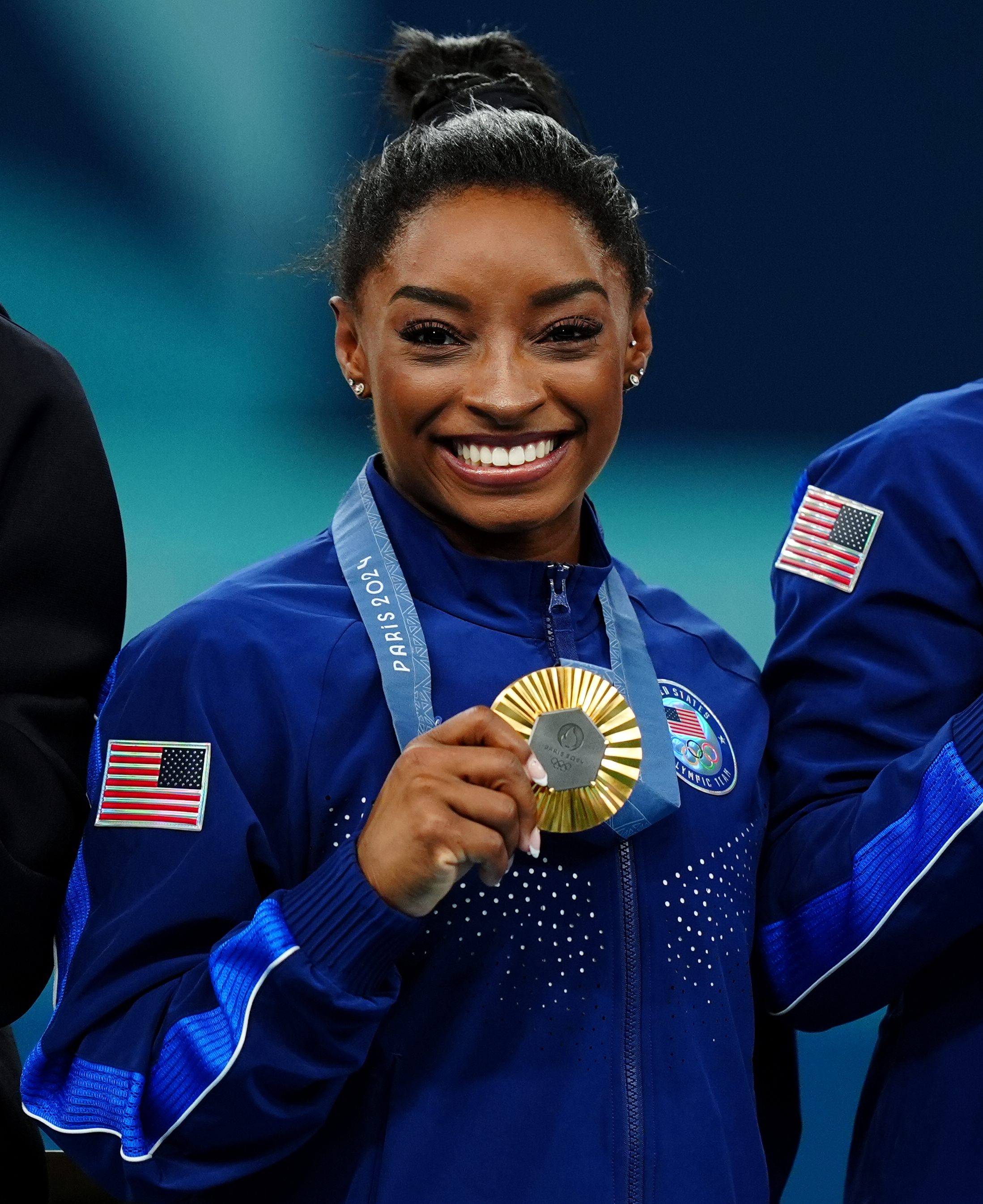 Simone Biles celebrating her gold medal win during the medal ceremony for the Artistic Gymnastics Women's Team Final in Paris, France on July 30, 2024 | Source: Getty Images