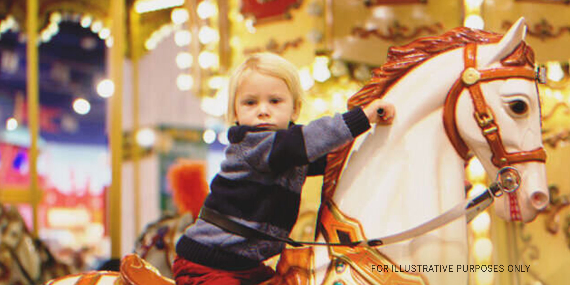 Young boy on carousel. | Source: Getty Images