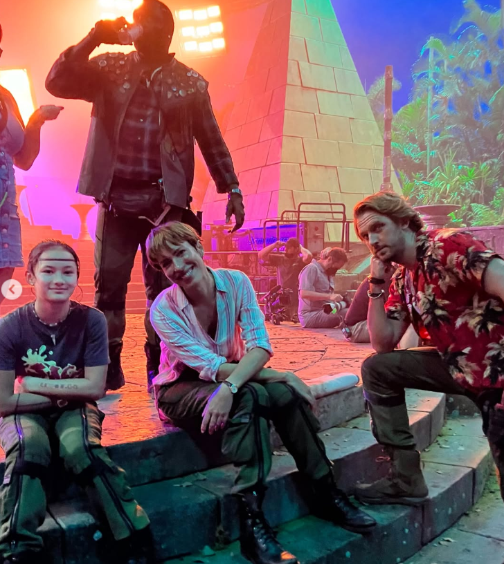 Kaylee Hottle poses with Rebecca Hall and fellow "Godzilla" cast members Brian Tyree Henry and Dan Stevens in a behind-the-scenes photo from the set of "Godzilla x Kong: The New Empire." | Source: Instagram/rebeccahall