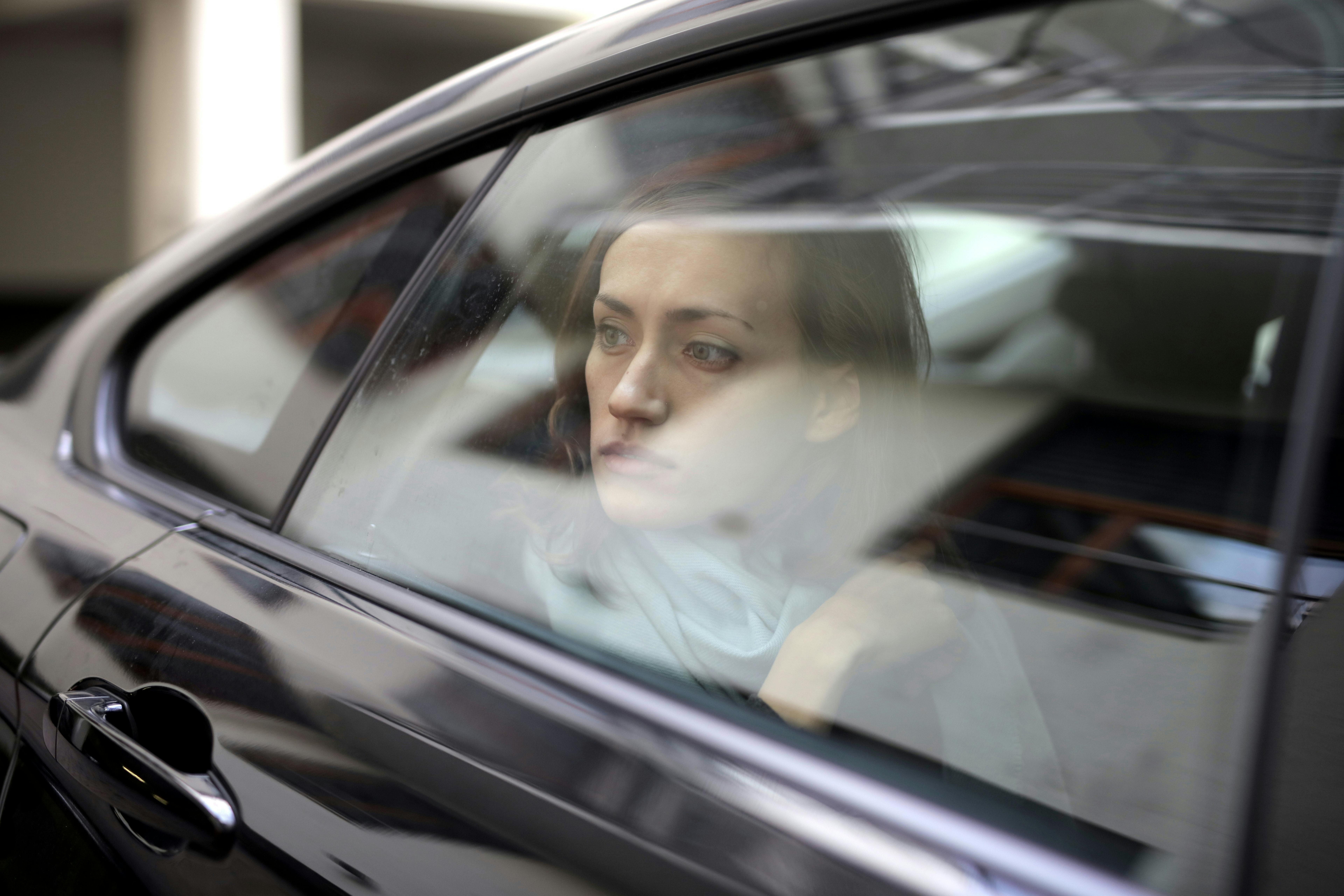 Woman looking out the window of a car | Source: Pexels