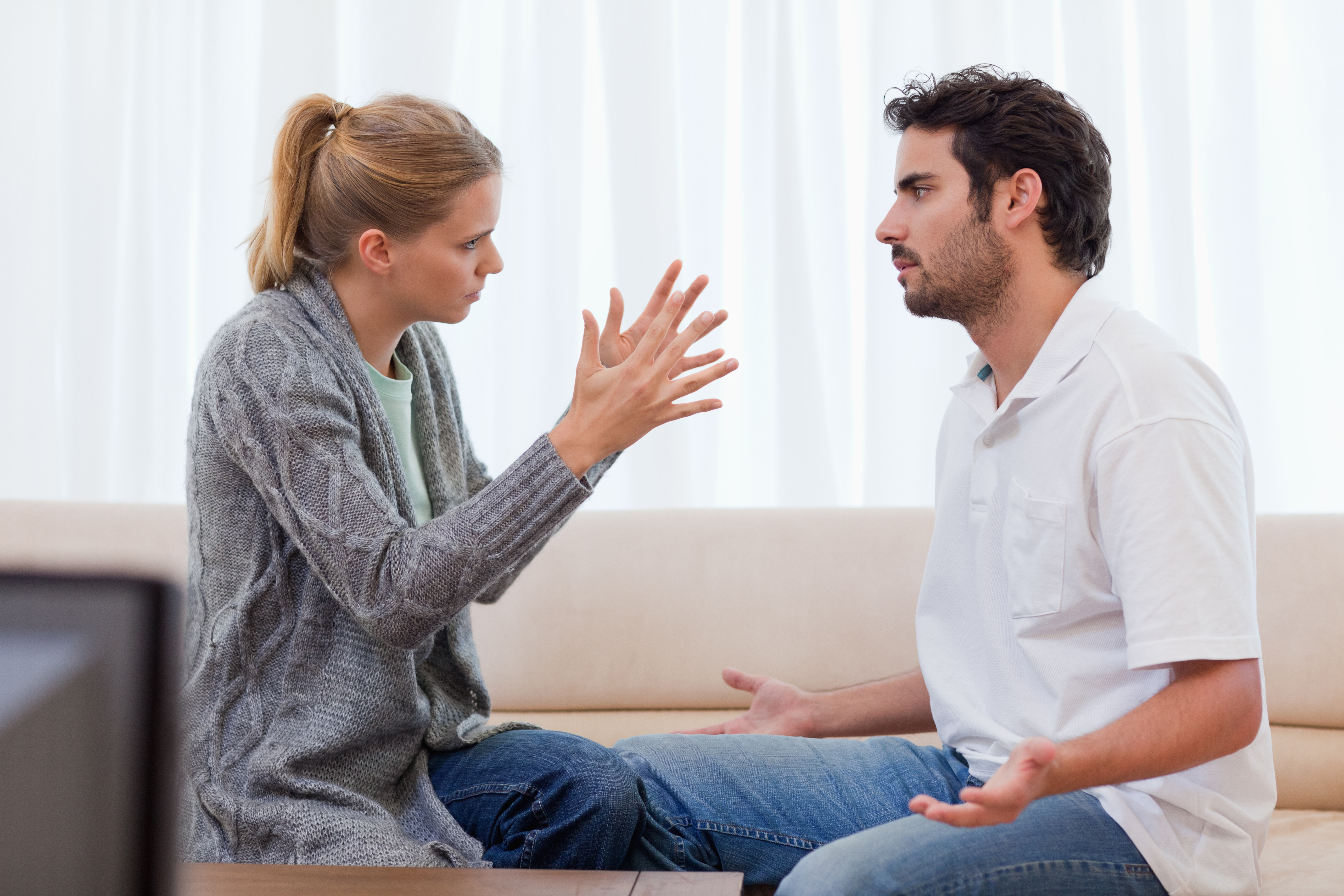 A wife being mad at her husband in their living room | Source: Shutterstock