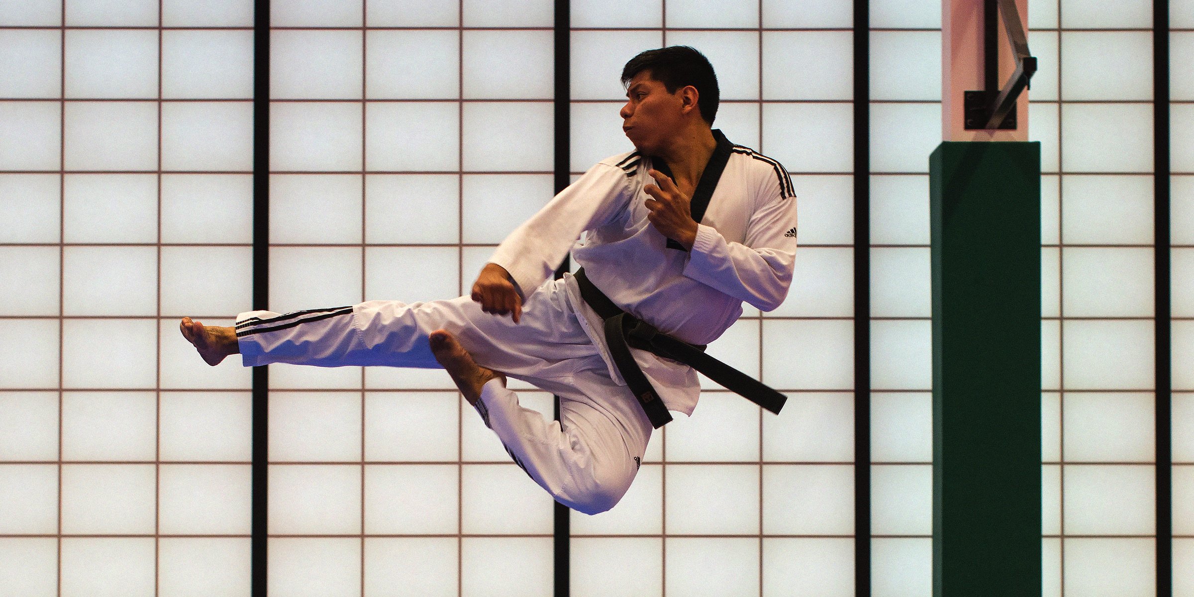 Unsplash | A man performing a martial arts move  
