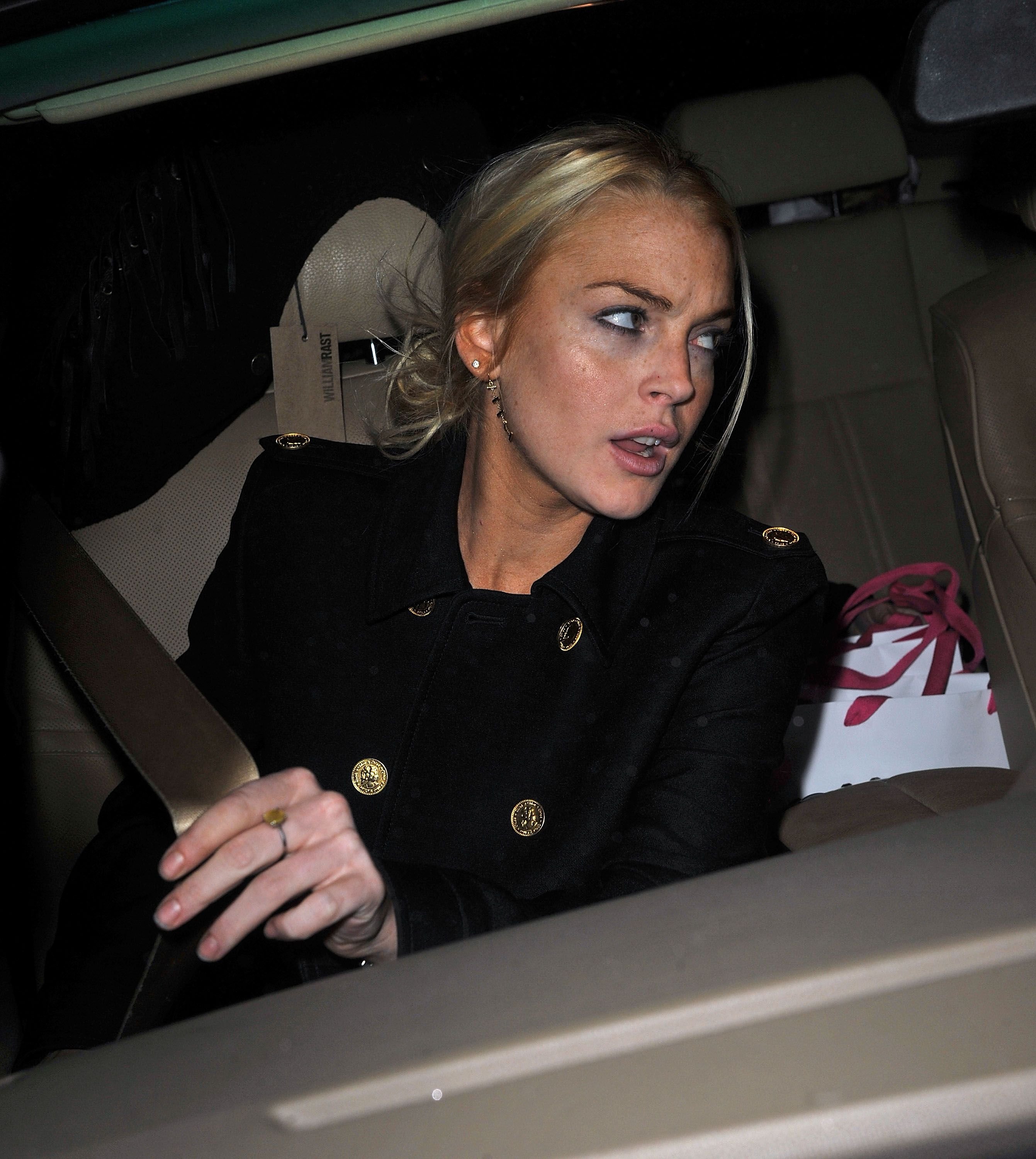 Lindsay Lohan leaving Intermix in SoHo in New York City. | Photo: James Devaney/WireImage via Getty Images