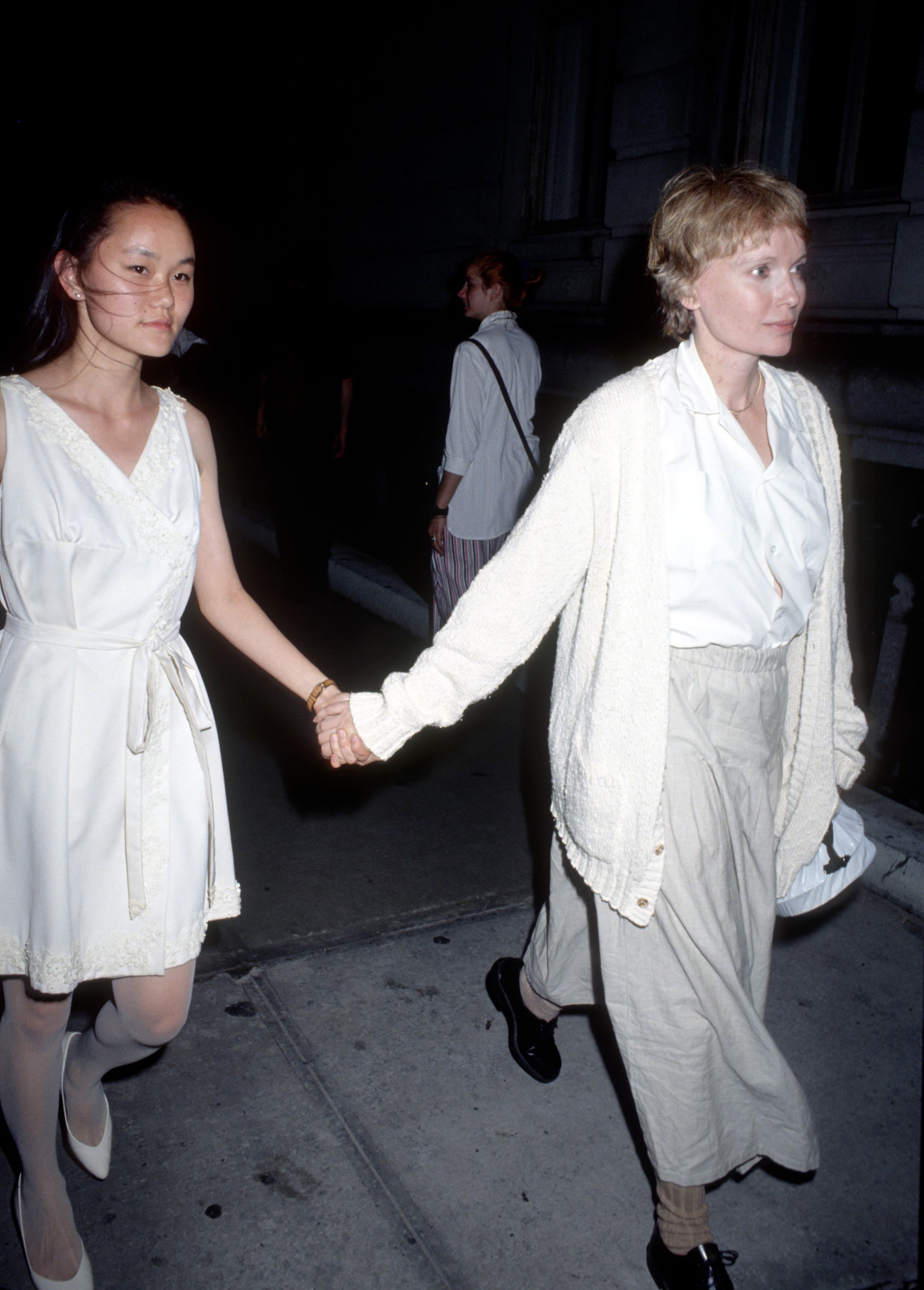 Soon-Yi Previn and Mia Farrow outside the actress' apartment in New York City, in 1991. | Source: Getty Images