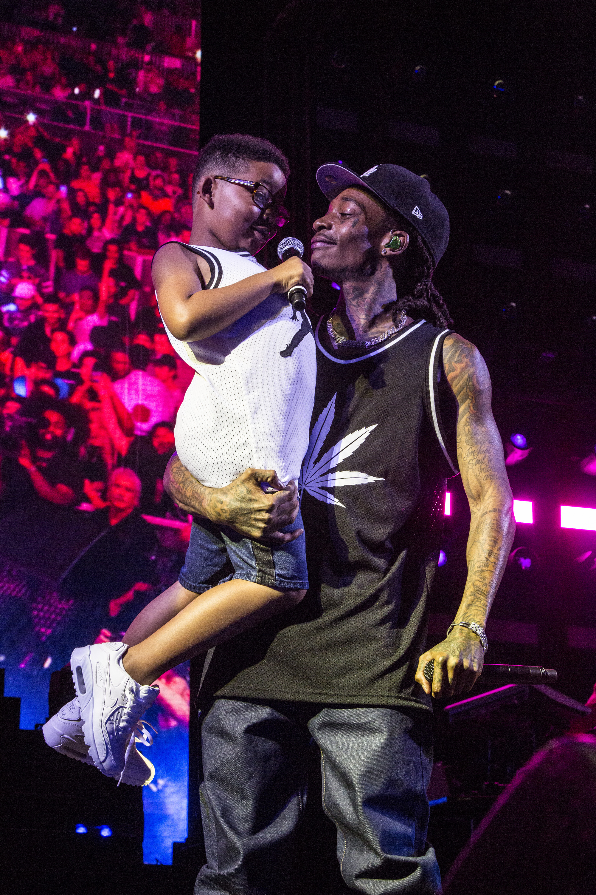 Wiz Khalifa and his son, Sebastian Taylor Thomaz, onstage at FivePoint Amphitheatre on August 9, 2019, in Irvine, California. | Source: Getty Images