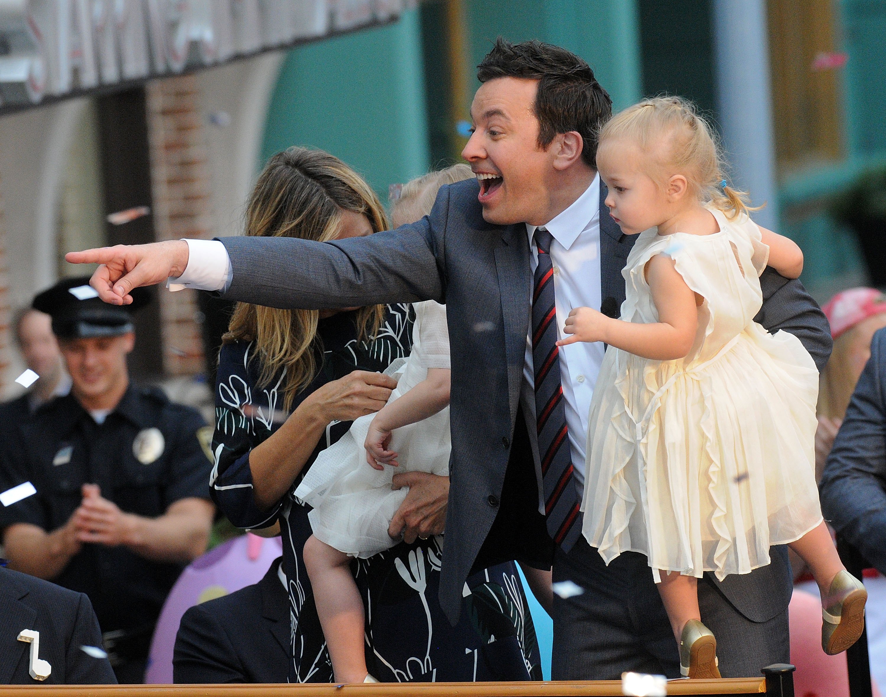 Jimmy Fallon and his daughter, Frances, are pictured greeting the audience during the Grand Opening of Universal Orlando's Newest Attraction "Race Through New York Starring Jimmy Fallon" at Universal Orlando on April 6, 2017, in Orlando, Florida | Source: Getty Images