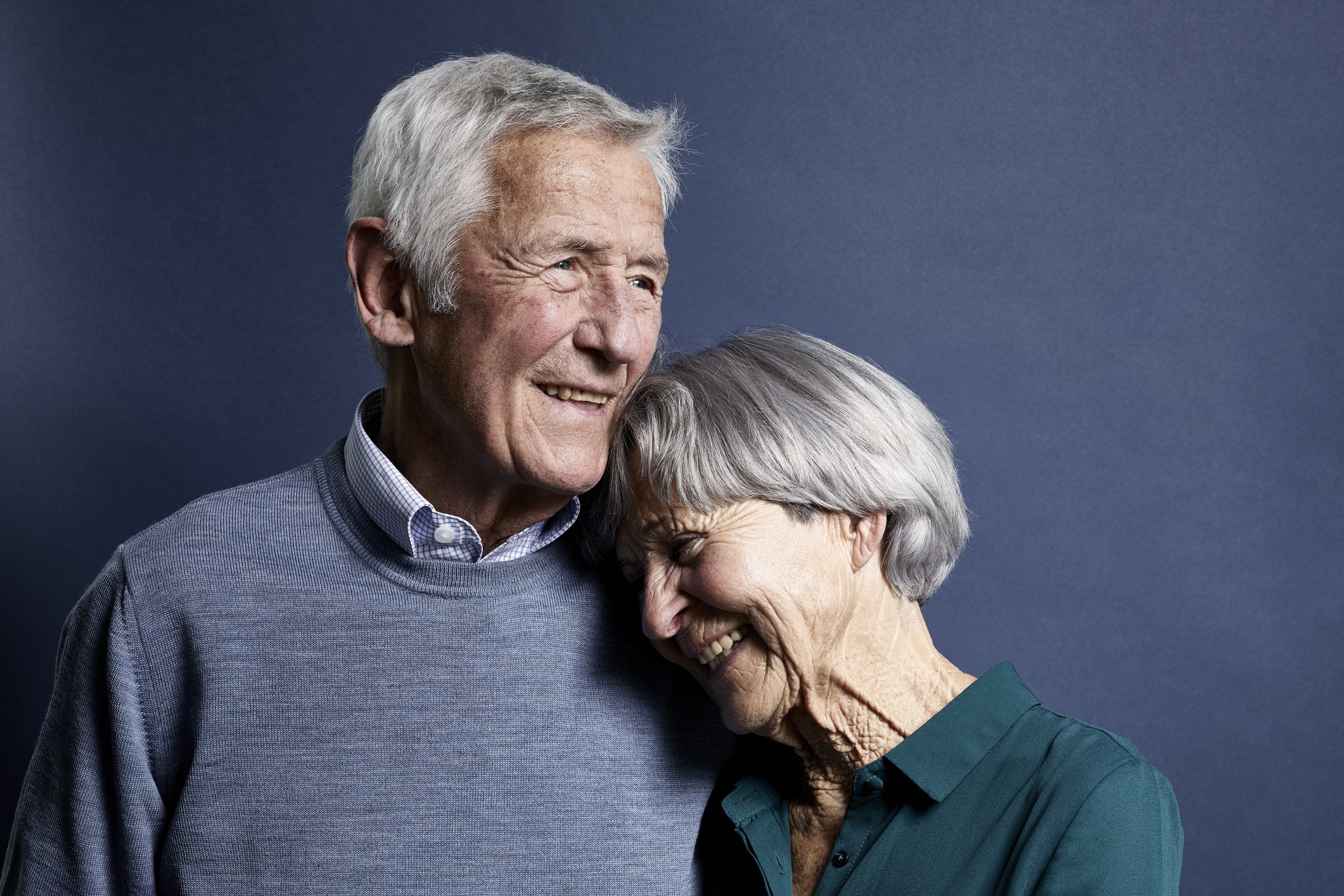 Portrait of an elderly couple holding each other in a warm embrace. | Photo: Getty Images