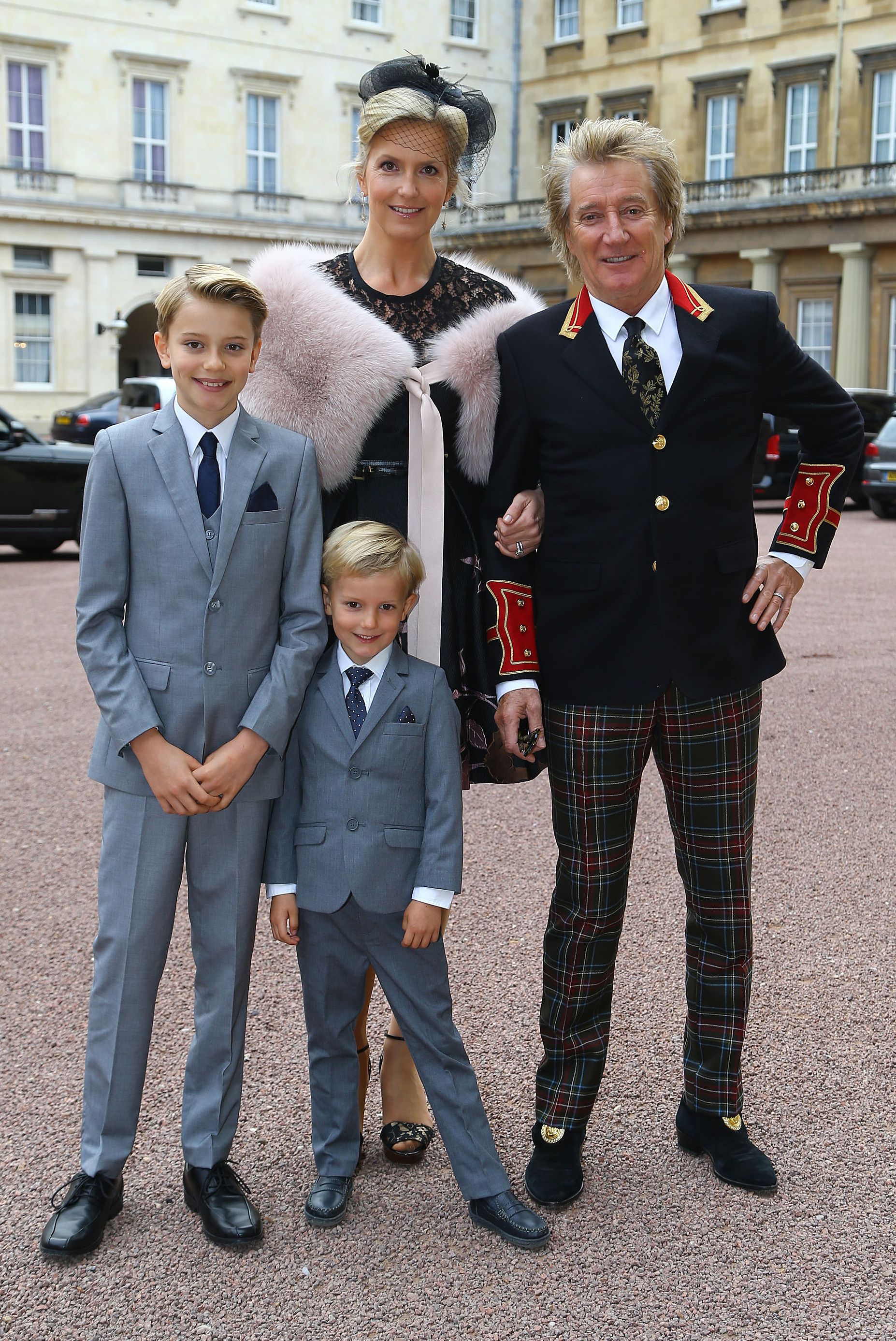 Rod Stewart and his wife Penny Lancaster with their children Alastair and Aiden at an investiture ceremony at Buckingham Palace in London on October 11, 2016 | Source: Getty Images