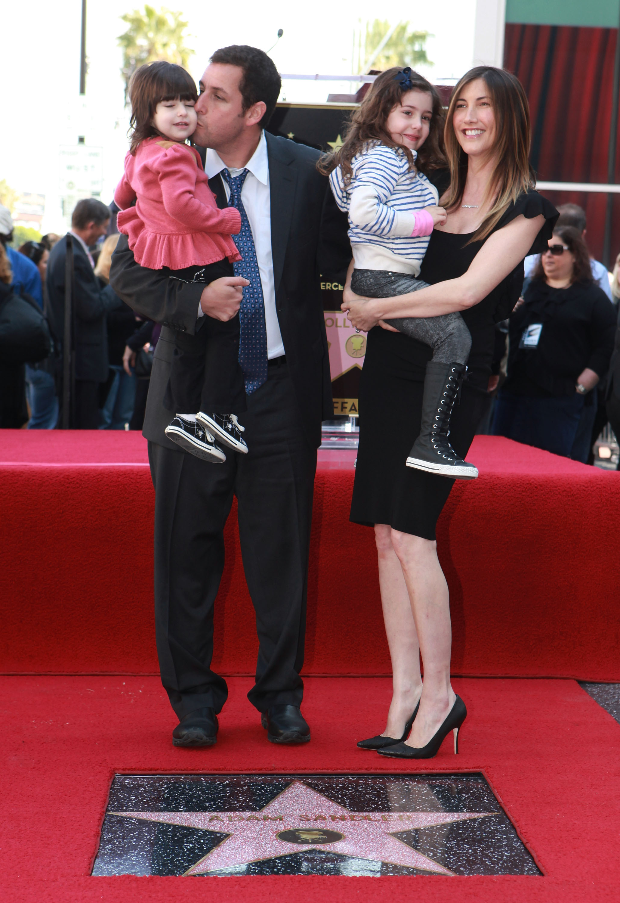 Adam Sandler shared a heartfelt milestone with his family as he was honored with a star on the Hollywood Walk of Fame. Beaming with pride, he posed with Jackie, Sadie, and Sunny, their joy reflecting the love and support behind his success.