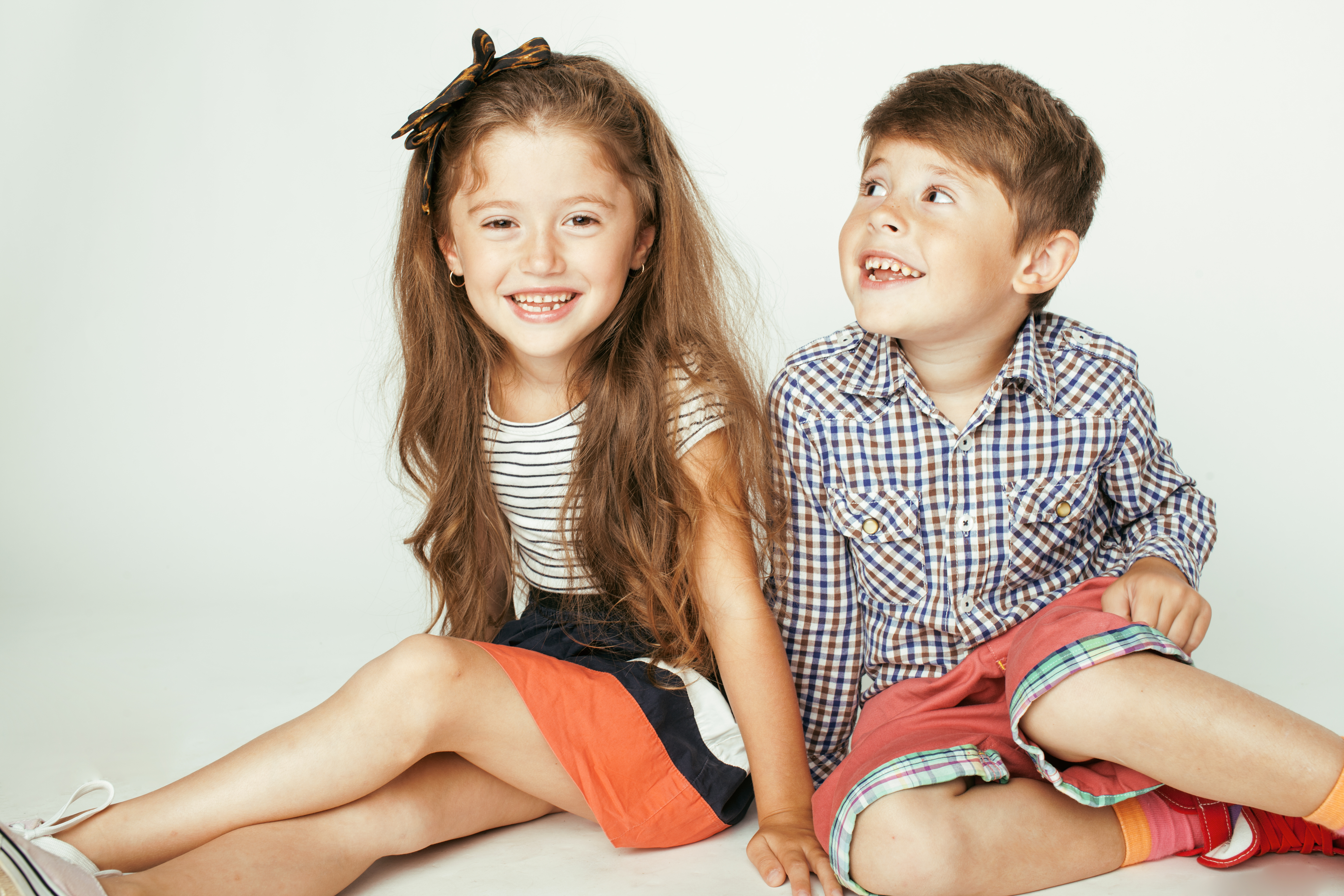 The woman thought the kids in front of her were twins. | Source: Shutterstock