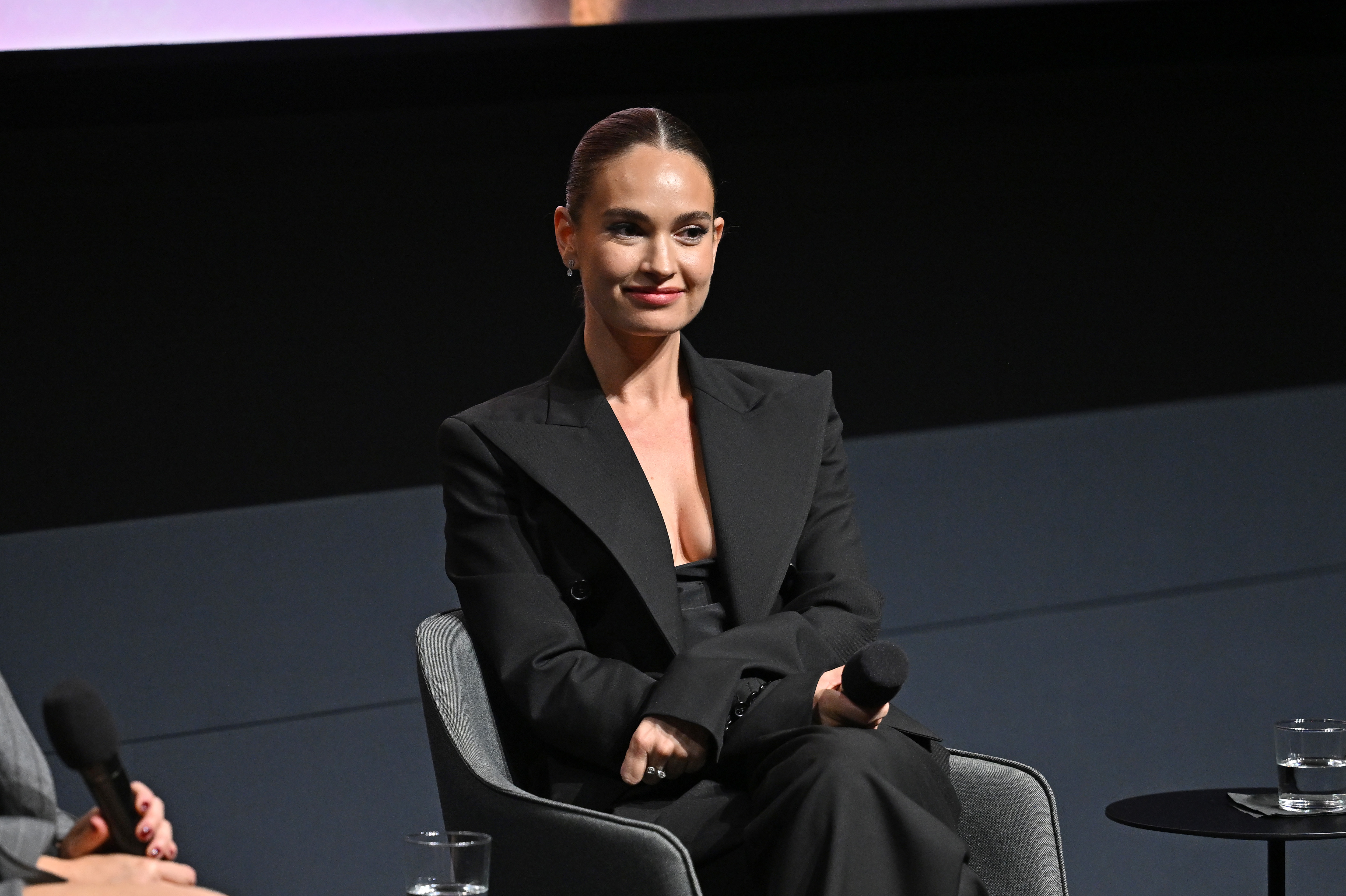Onstage at the 2025 New York screening of "Swiped," James embraced a sleek, modern aesthetic in a sharply tailored black suit with bold lapels. Wearing her hair slicked back into a neat bun and minimal jewelry, she embodied quiet confidence and sophistication, reflecting her evolution into a leading lady.