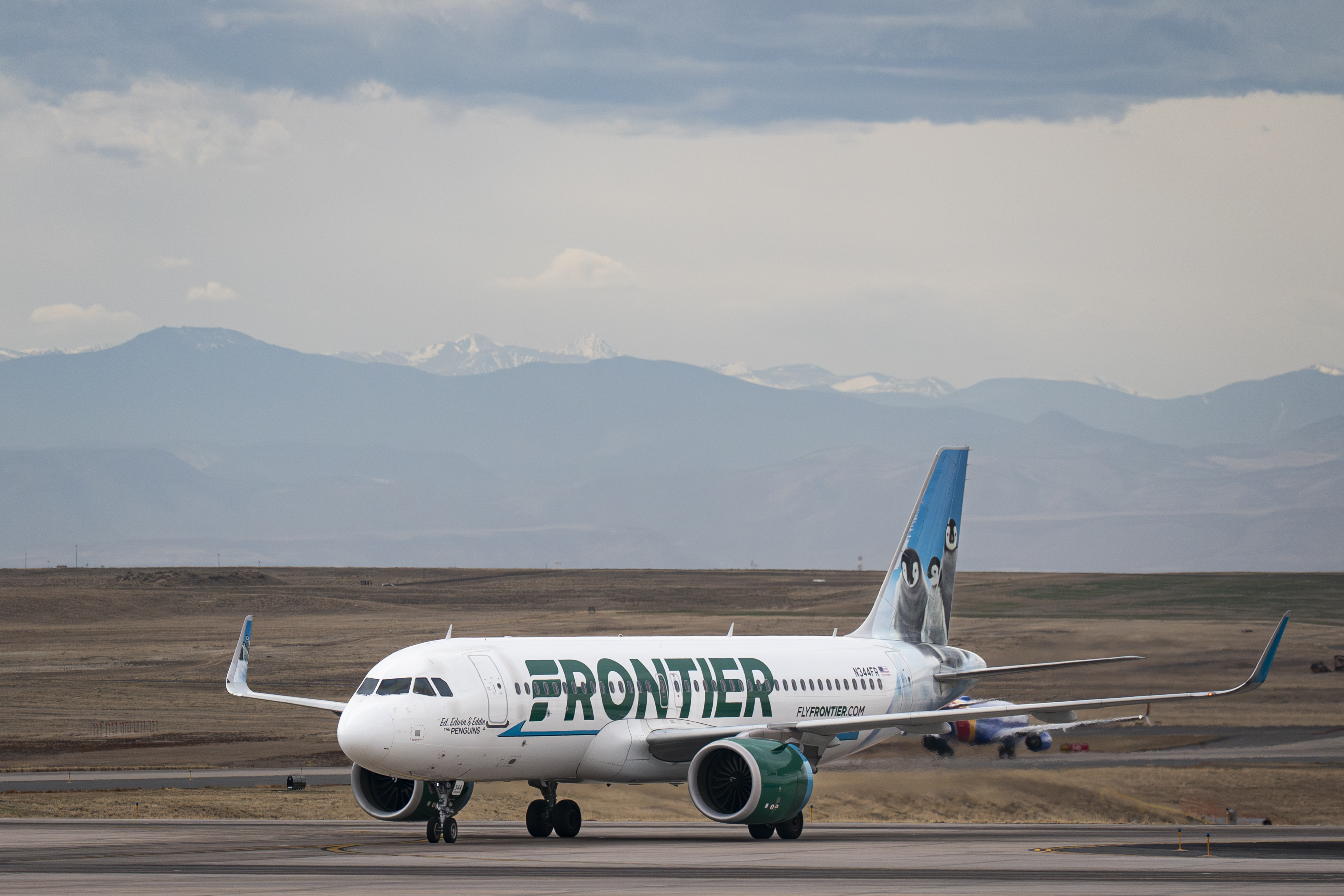 A Frontier Airlines plane taxis at Denver International Airport in Colorado | Source: Getty Images