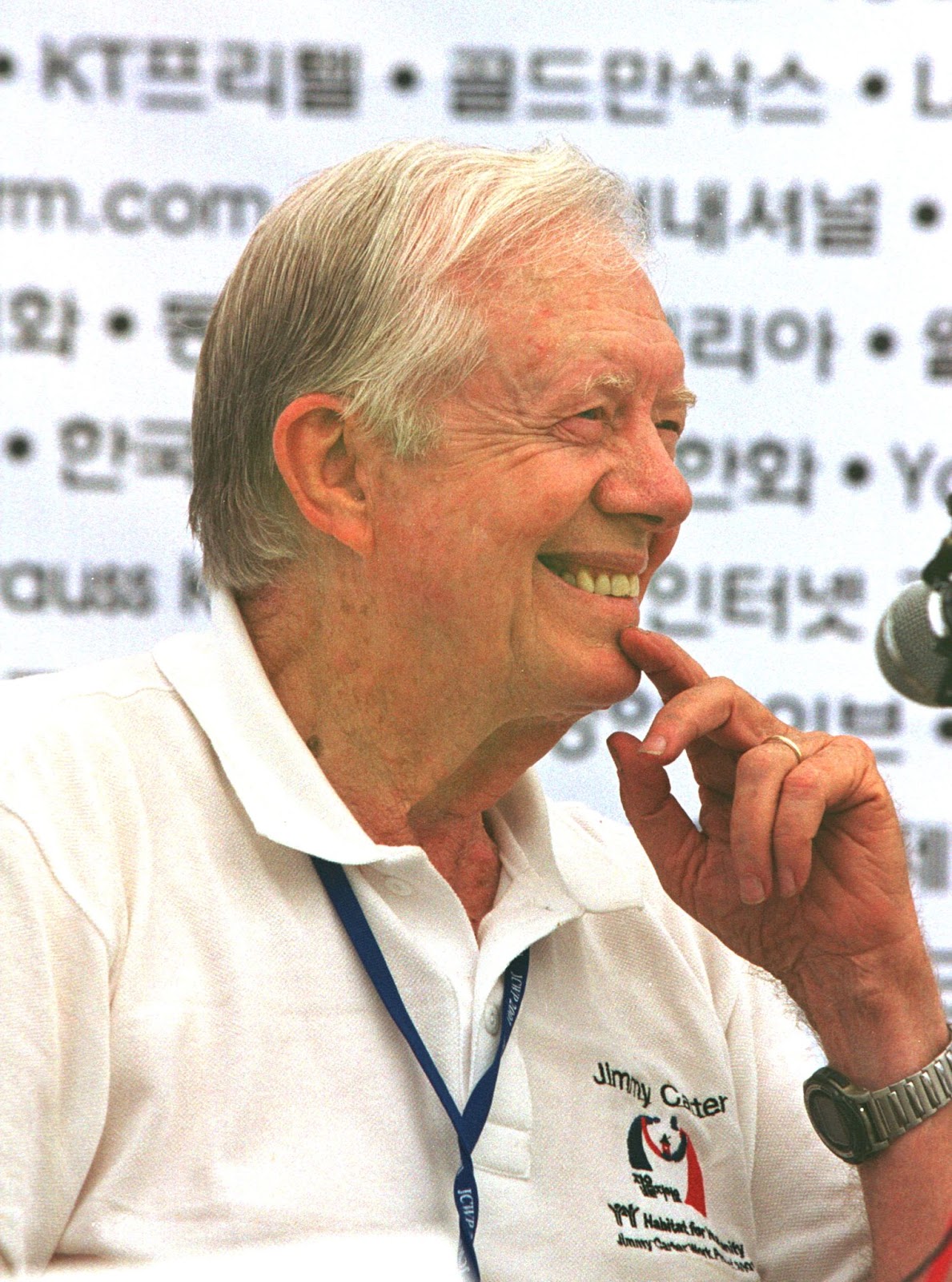 Former U.S. President Jimmy Carter smiles during a news conference on August 6, 2001, in Asan, South Korea. | Source: Getty Images