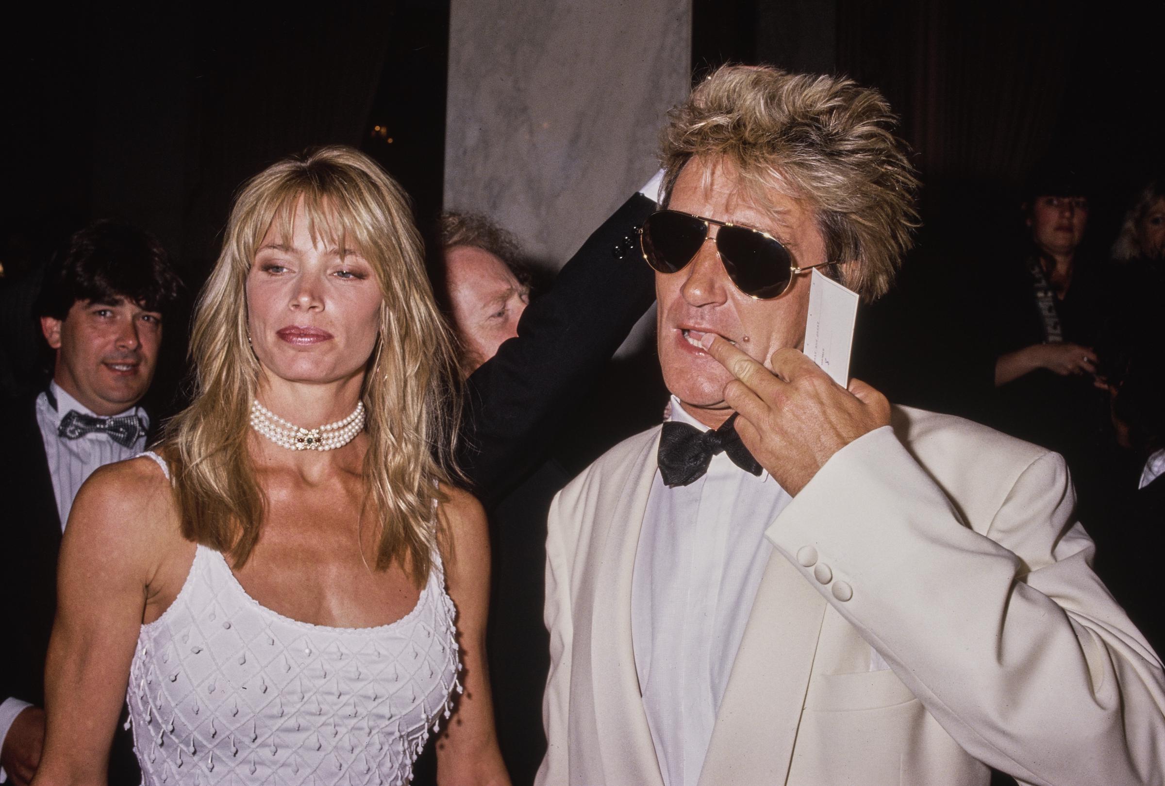 American model Kelly Emberg and her partner, British singer and songwriter Rod Stewart, attend the 7th Annual ASCAP Pop Music Awards at the Beverly Wilshire Hotel in Beverly Hills, California, on May 16, 1990. | Source: Getty Images
