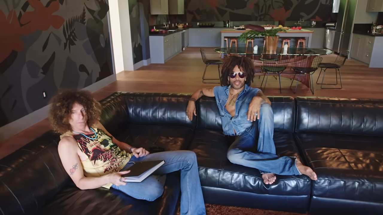 Seated together on the sleek leather couch, Lenny and Craig Ross catch up inside the guesthouse lounge, which serves as a creative rehearsal hub for the band. | Source: YouTube/@Archdigest